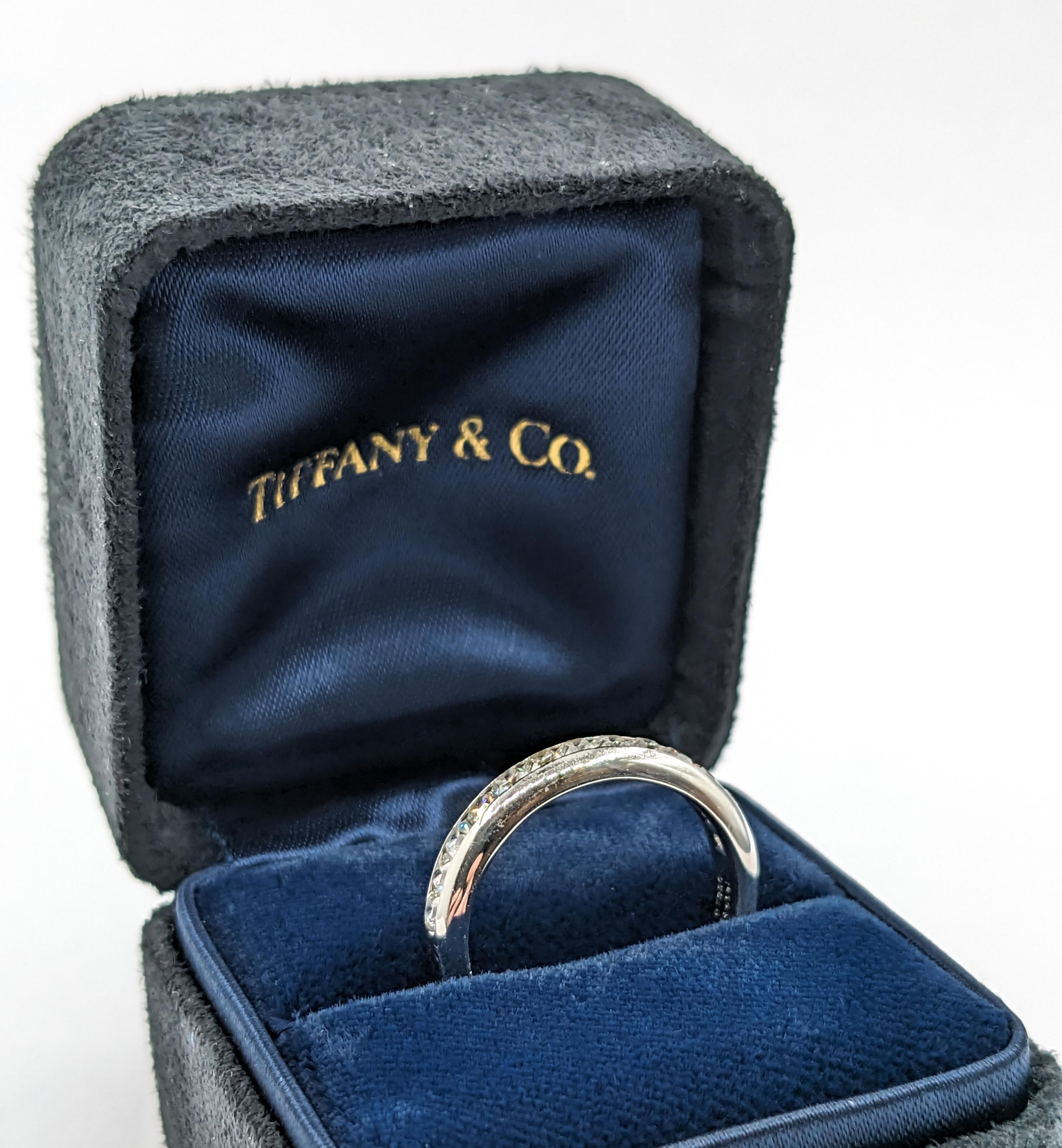 Tiffany & Co Lucida Diamond Channel Band Ring in Platinum 

Introducing our stunning authentic Tiffany & Co band ring, a masterpiece crafted with the utmost precision in premium platinum. This exquisite ring is adorned with 1.00ctw of radiant Lucida