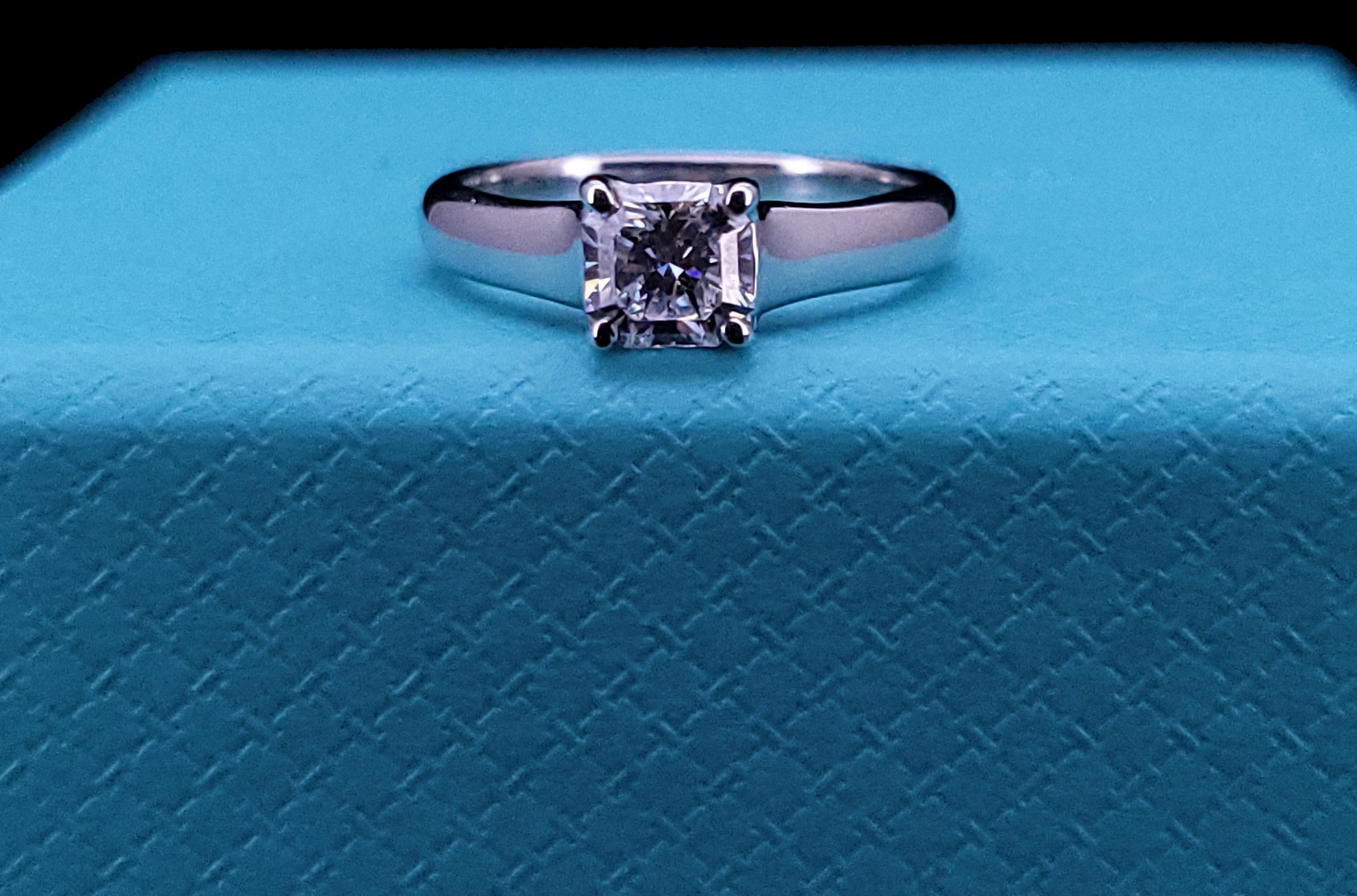 One Tiffany & Co. Platinum and diamond solitaire ring, set with one LUCIDA cut-cornered square mixed cut diamond weighing .59 carat,
Diamond Clarity VVS2
Color Grade F
Ring Size 4.25 but it can be resized by a jeweler
Ring Weight 4.4 gm
Condition