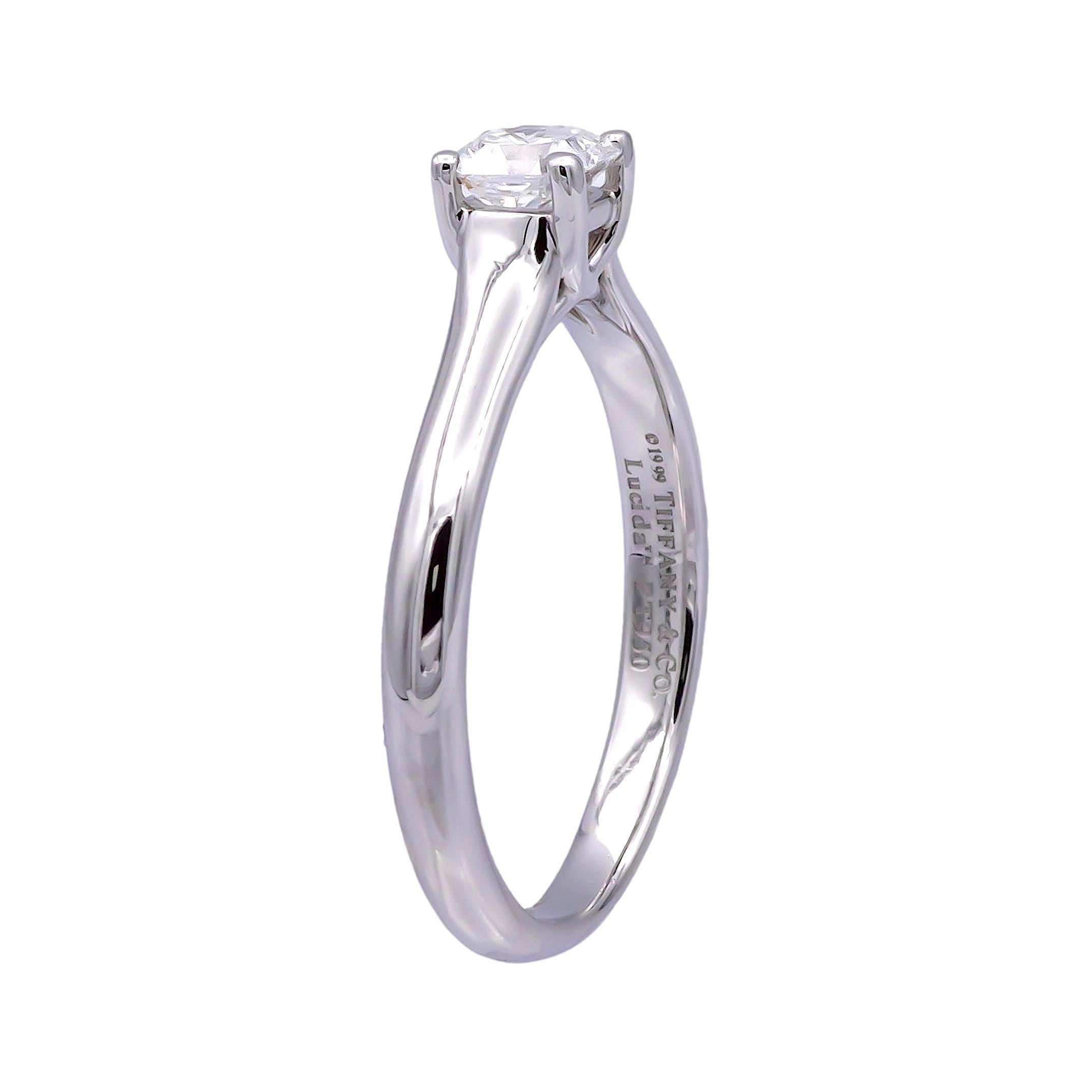 Tiffany & Co. engagement ring from the Lucida collection finely crafted in Platinum featuring a 0.34 carat center, E-F color and VVS1-VVS2 clarity. Graded by the Gemological Institute of America. Fully hallmarked with logo, serial number and metal