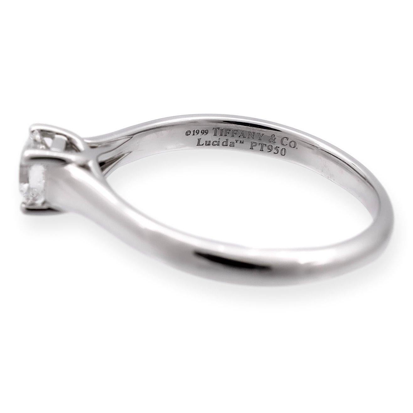 Tiffany & Co. engagement ring from the Lucida collection finely crafted in Platinum featuring a 0.34 carat center, E-F color and VVS1-VVS2 clarity. Graded by the Gemological Institute of America. Fully hallmarked with logo, serial number and metal