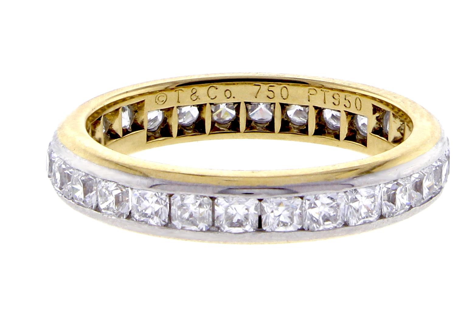 From Tiffany & Co Lucida collection, a diamonds band ring . The ring contains 27  Tiffany Lucida cut diamonds weighing approximately 2.16 carats. The diamonds are  set in a platinum channel in an 18 karat yellow fold band. F-G color and VVS clarity.