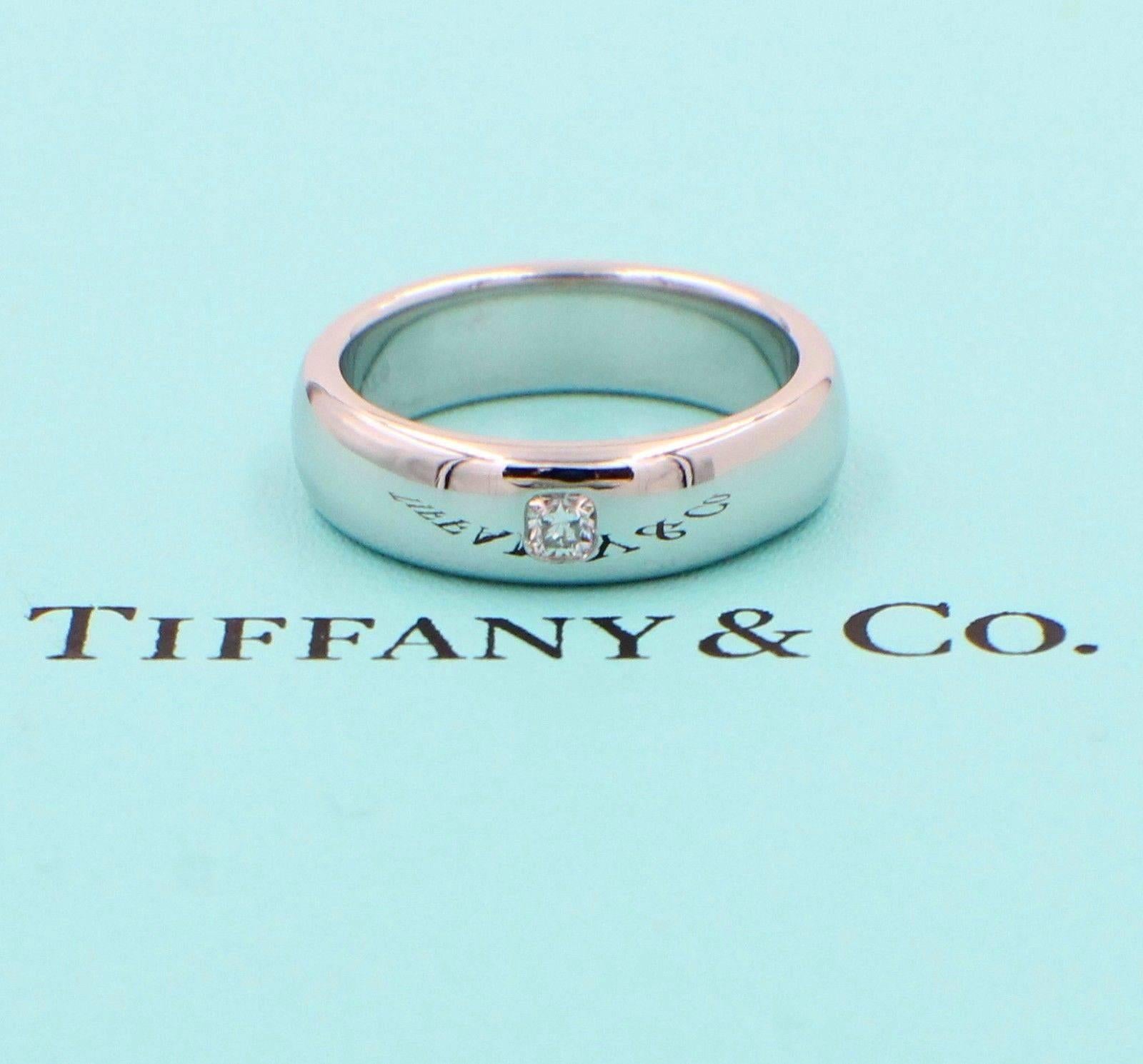 Tiffany & Co.
Style:  Classic Band Ring with Diamonds
Serial Number:  21187631
Metal:  Platinum PT950
Width:  6 MM
Size:  8 - sizable
Total Carat Weight:  0.11 TCW
Diamond Shape:   Lucida
Diamond Color & Clarity:  F / VVS
Hallmark: 