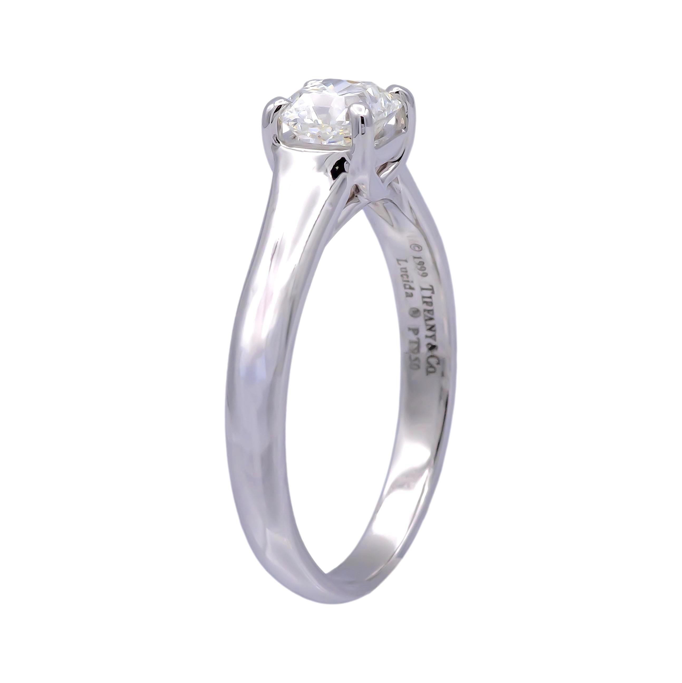 Tiffany & Co Lucida engagement ring with 0.60 carat center H color VVS2 clarity finely crafted in Platinum.  This ring would retail today at $6,200 based on Tiffany True cut pricing

Ring Specifications
Brand: Tiffany & Co.
Hallmark: Tiffany & Co ©