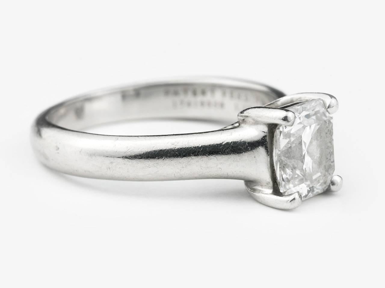 Platinum ring centering a 1.13 carat square mixed cut diamond, graded D color, VVS2 clarity. Lucida by Tiffany and Co. Signed with Tiffany certificate.