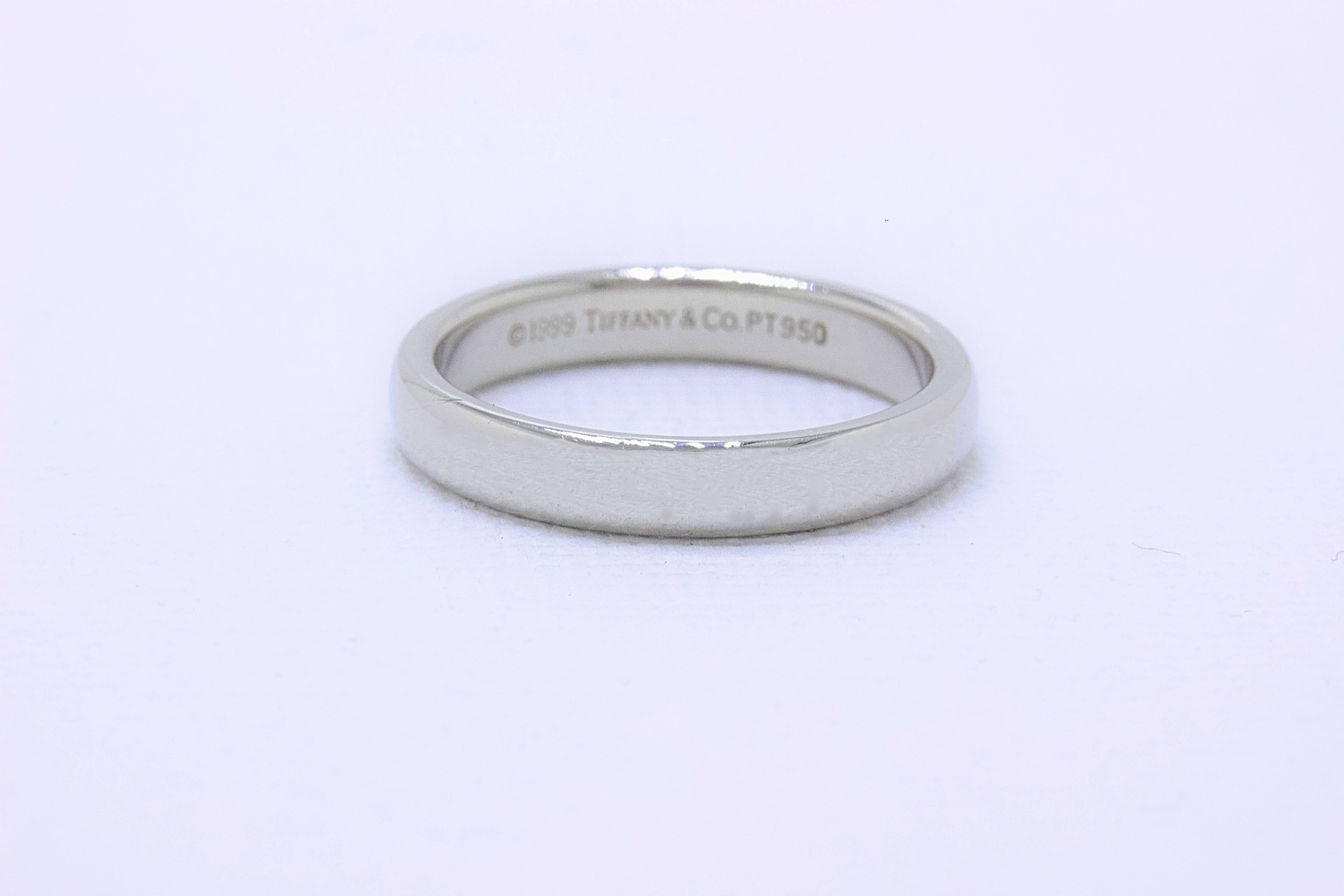 Tiffany & Co.
Style:  Lucida Wedding Band
SKU Number:  14761594
Metal:  Platinum PT950
Size:  4.5 - sizable  
Width:  3 MM  
Hallmark:  ©TIFFANY&CO.PT950
Includes:  Tiffany & Co. Jewelry Pouch

Retail Value:  $1,150 + tax = $1,239.12