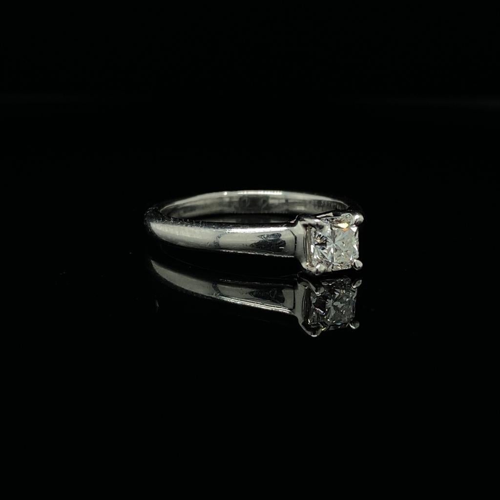 A Tiffany & Co 'Lucida' princess cut diamond engagement ring, platinum 0.49 carat.
	
From the Tiffany ‘Lucida’ collection, this beautiful ring is set with a 0.49 carat princess cut diamond mounted within four platinum claws on a tapered band.

This
