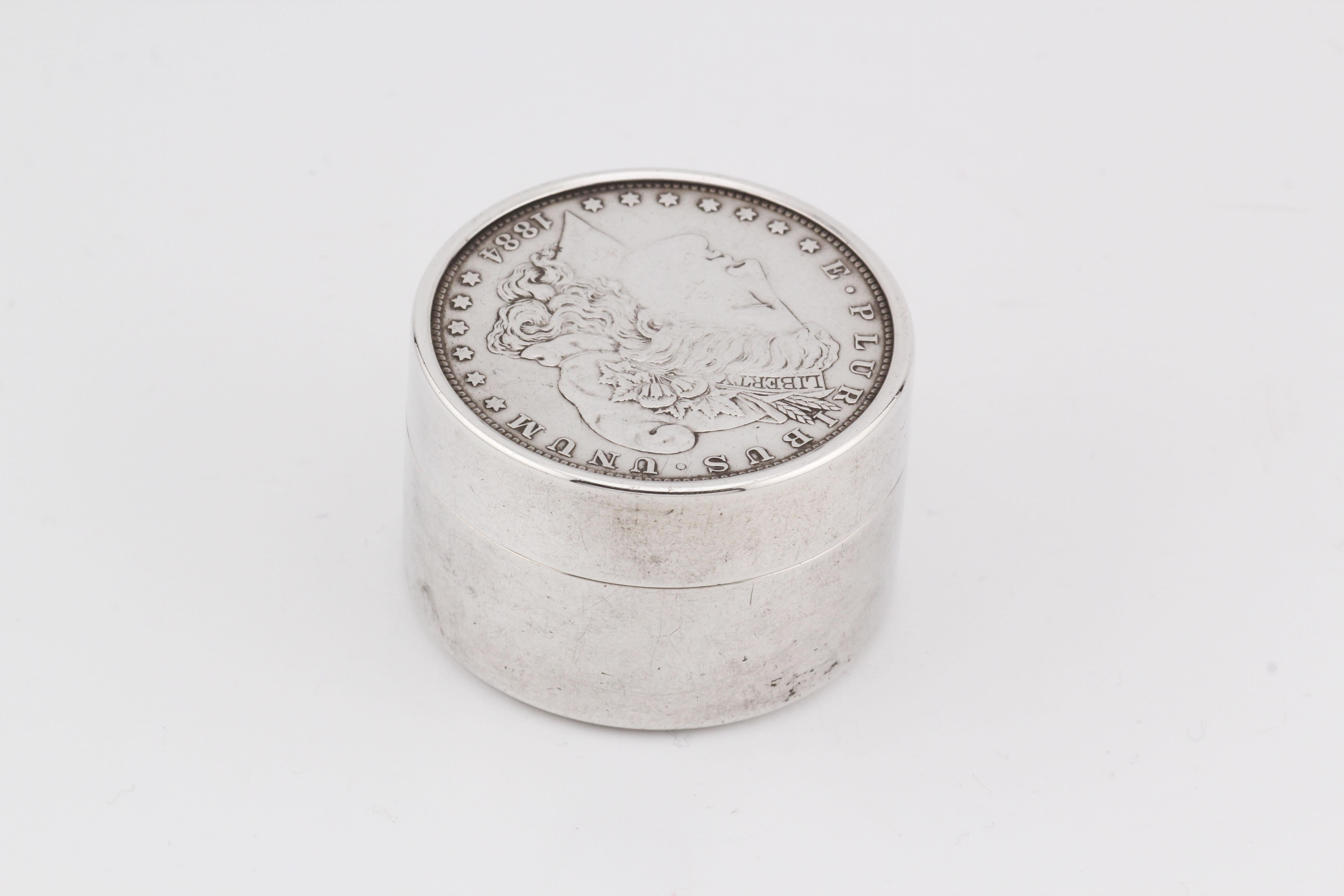 Elevate your everyday essentials with the timeless elegance of this Tiffany & Co. Makers 1884 Silver Dollar Sterling Silver Pill Box. Expertly crafted from gleaming sterling silver, this exquisite piece is a testament to Tiffany’s enduring legacy of