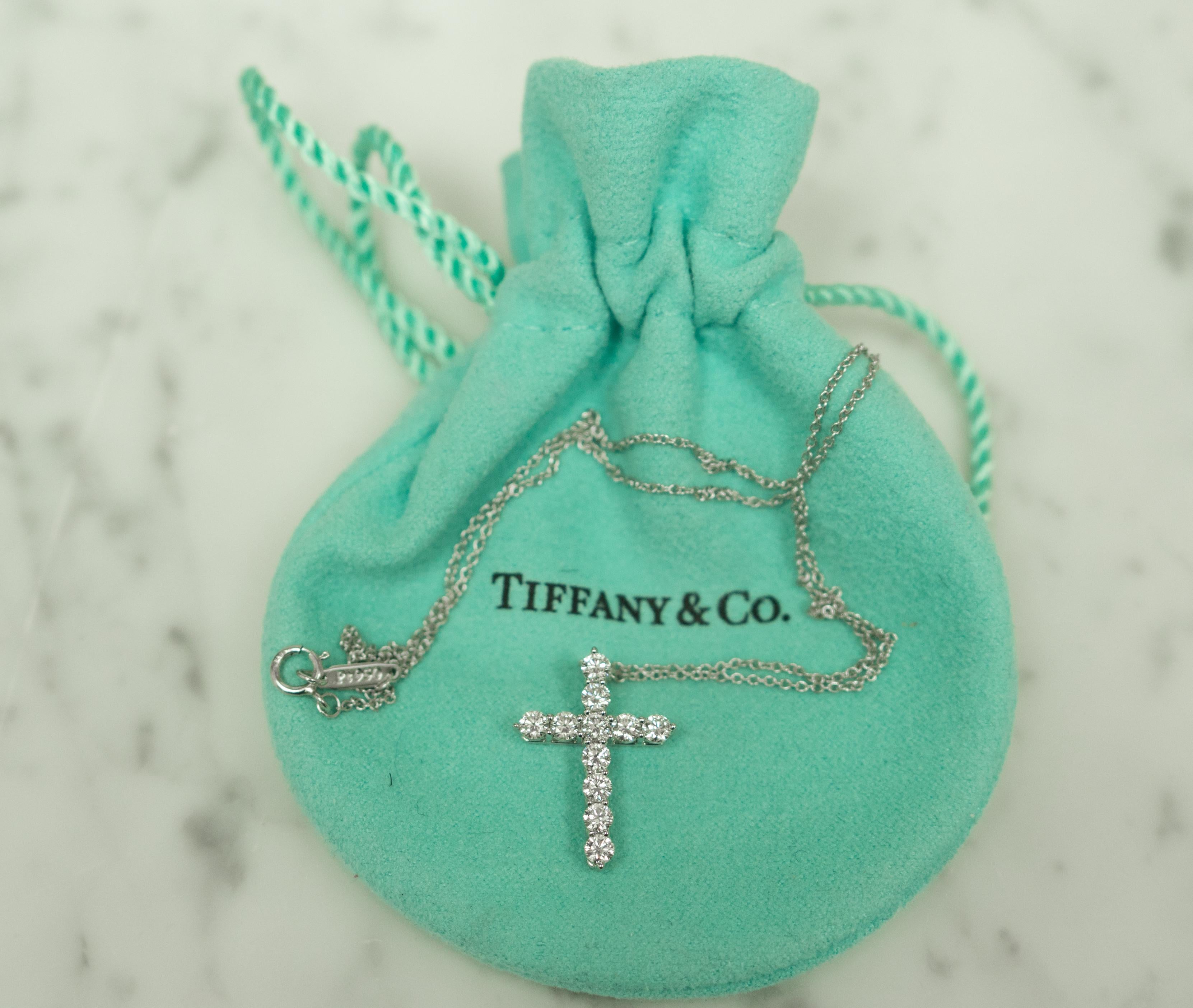 Tiffany & Co. Medium diamond Cross pendant in platinum with 11 round brilliant diamonds, E-F Color , VS clarity,  with total weight of .90 carats on a 16
