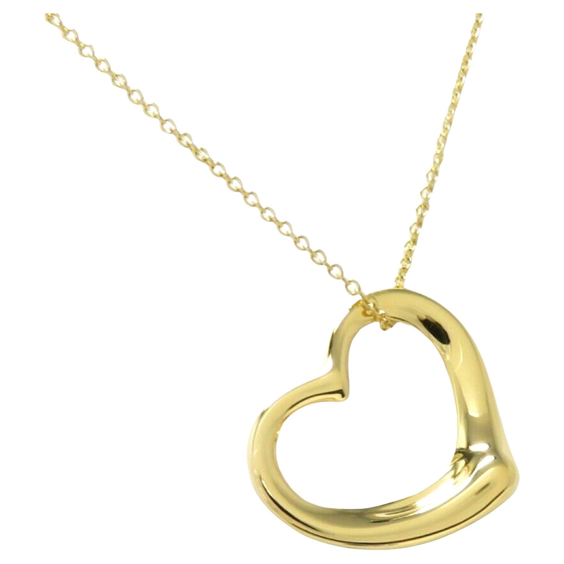 Authentic Tiffany & Co Elsa Peretti® 18K Yellow Gold Small Open Heart Pendant / Necklace.

 The chain with pendant weigh 2.8 grams. Pendant in 18k gold. Size Small, on a 15