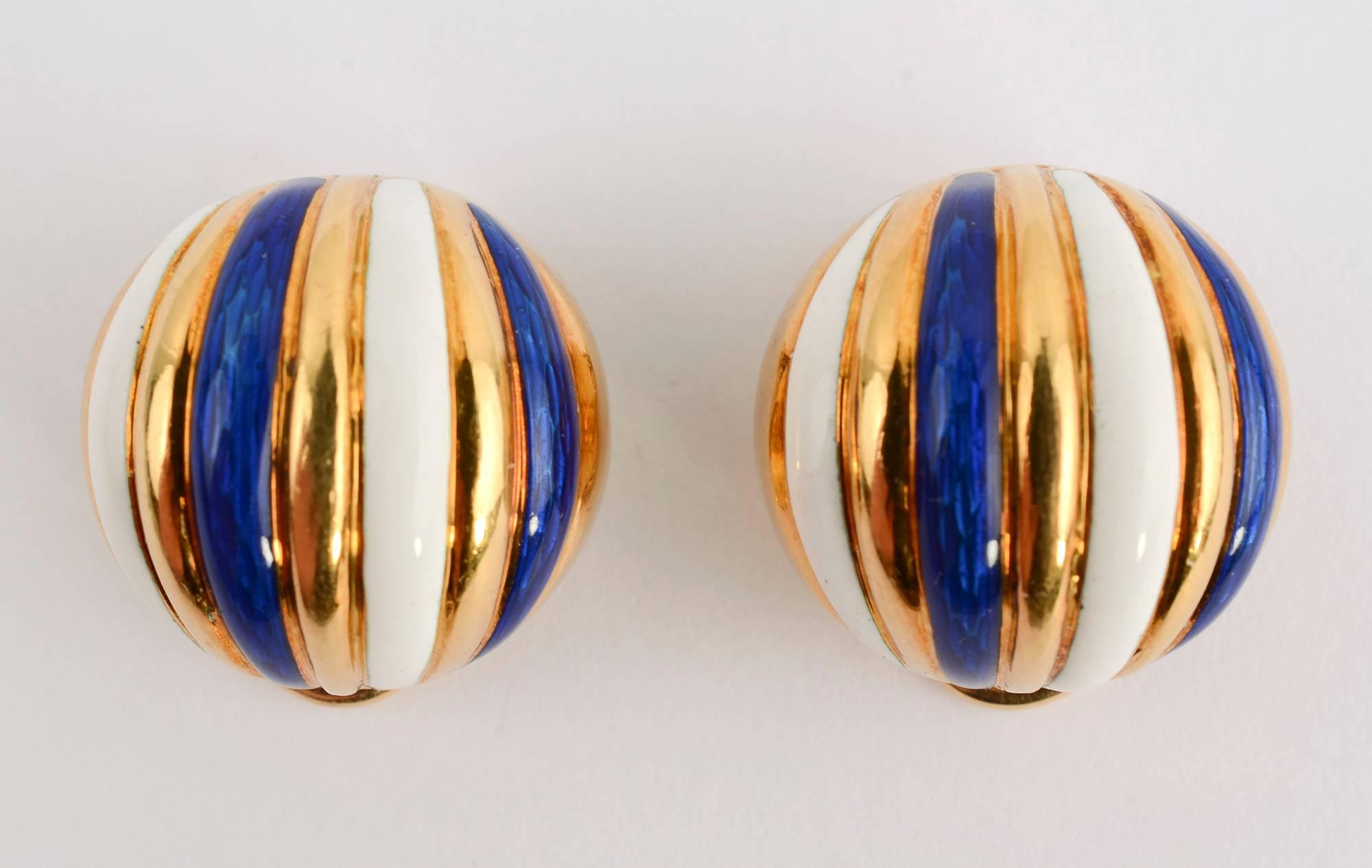 Dome shaped earrings by Tiffany in which bands of  18 karat gold alternate with bands of blue and white enamel. They are 3/4 inch in diameter. Clip backs can be converted to posts.
Dark spots are on photos only. Condition is excellent.