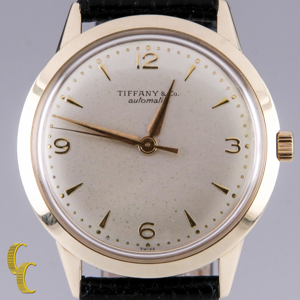 17 Jewel Tiffany & Co. Automatic Movement
Movement #AS.1580
Case #R4581-3285
14k Yellow Gold Case
33 mm in Diameter (35 mm w/ Crown)
Lug-to-Lug Length = 38 mm
Lug-to-Lug Width = 17 mm
Champagne Dial w/ Gold Numbers, Tic Marks, and Hands (S, M, H)
28