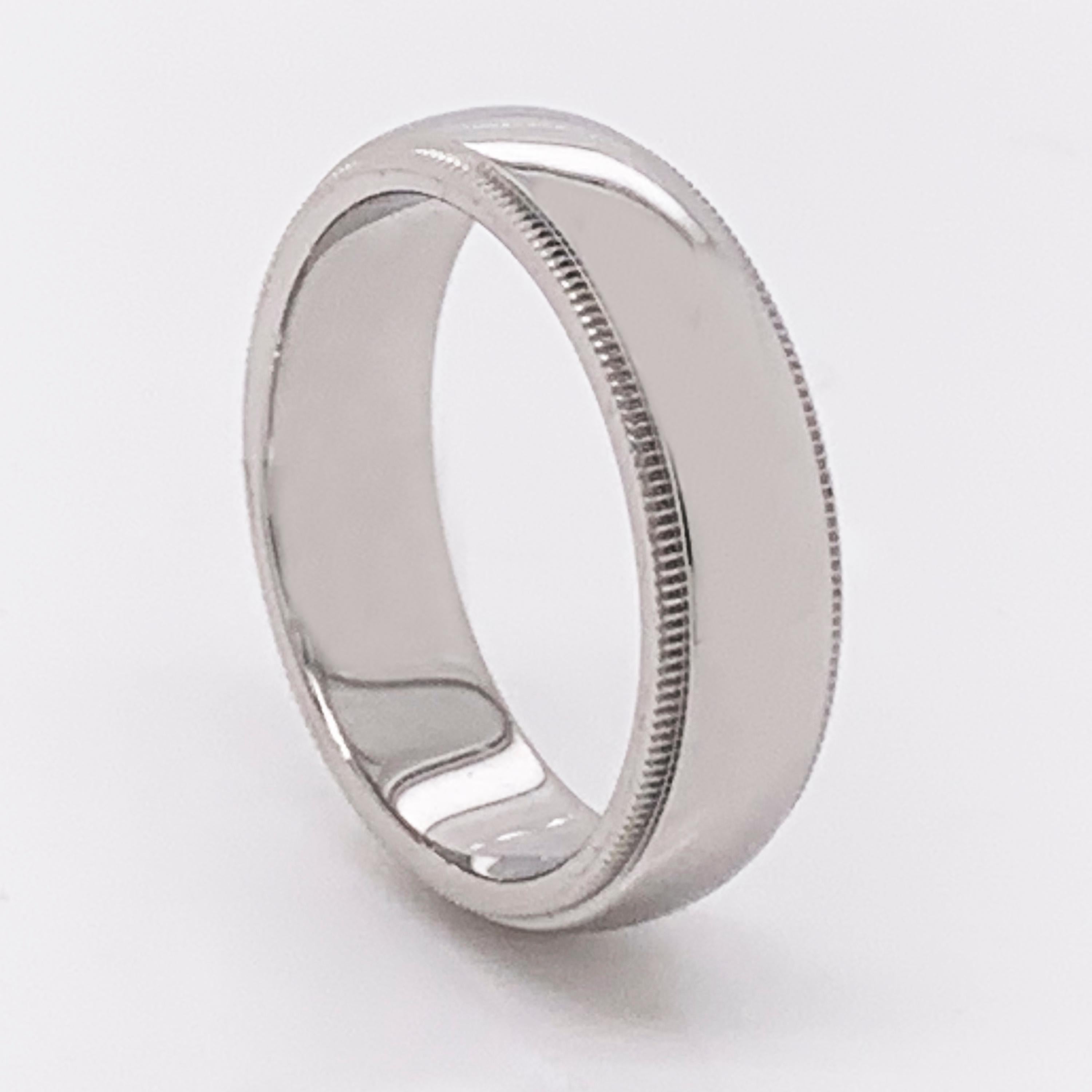 This Tiffany & Co. platinum men's wedding band features a milgrain textured pattern on each edge.  

6mm wide.
Size 9 US (59 EU).
14 grams.  