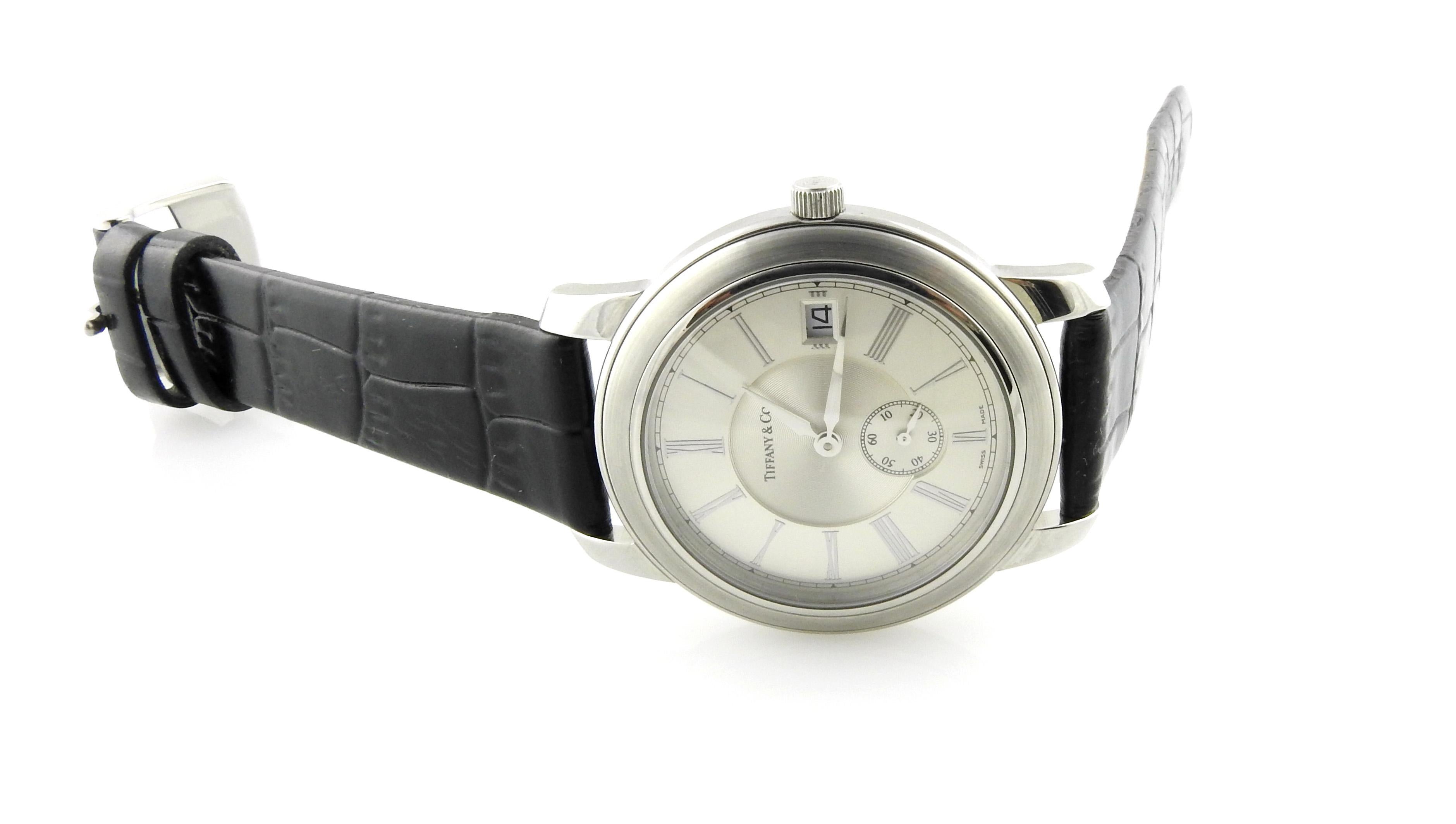 Tiffany & Co. Atlas Mark Round Men's Watch

Serial: 060224816

This classic Tiffany Atlas Watch has stainless steel case approx. 36mm in diameter.

Silver Roman Dial with date

Black leather Tiffany band with Stainless Tiffany tang buckle

Automatic