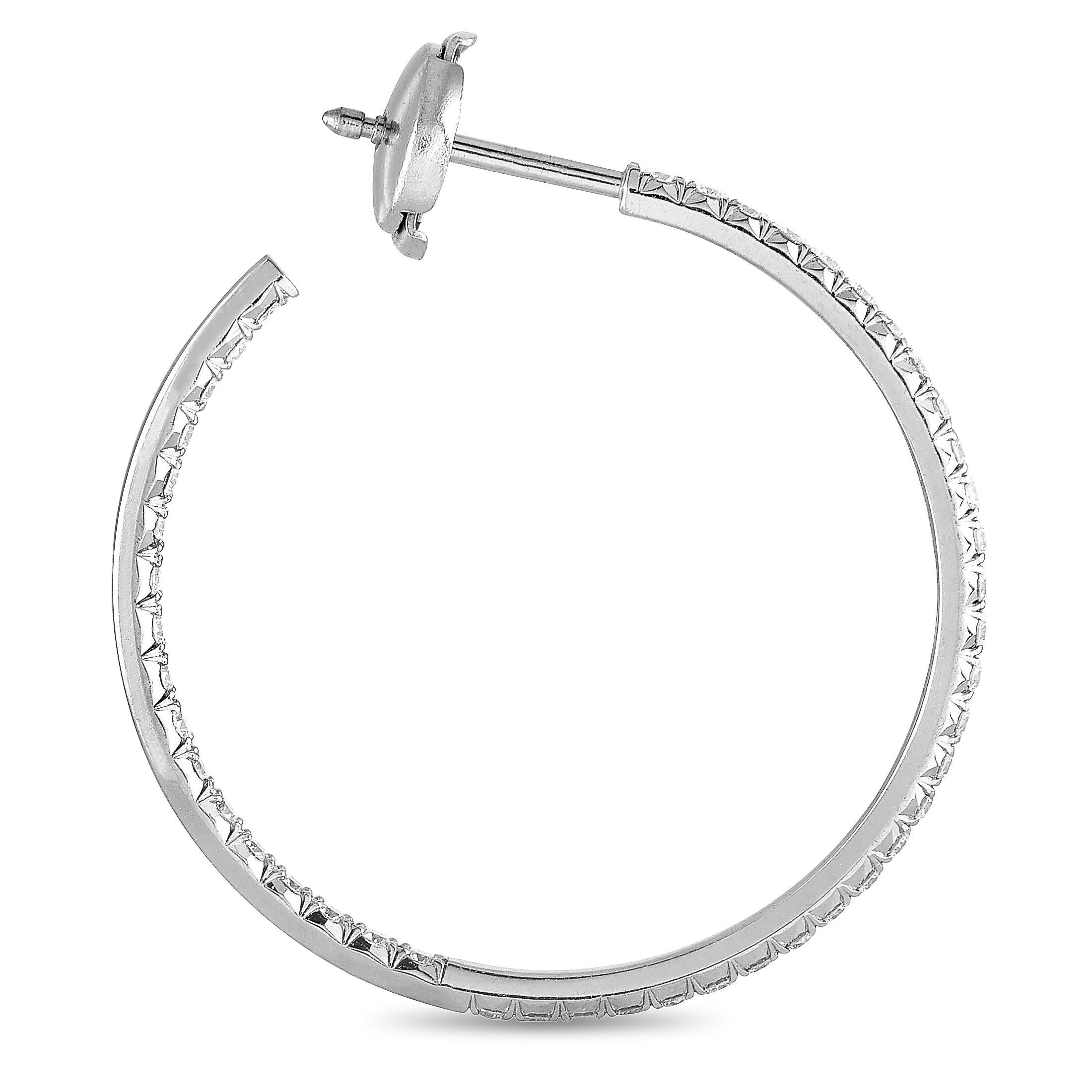 The Tiffany & Co. “Metro” earrings are made out of 18K white gold and diamonds that total 0.74 carats. Each of the two earrings weighs 3.25 grams and they measure 1.25” in length and 1.25” in diameter.

This pair of earrings is offered in estate