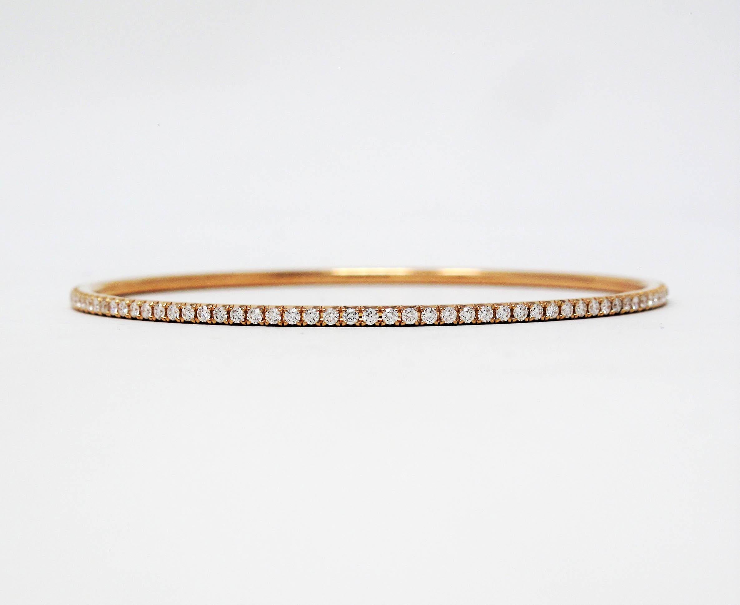 Simple yet stunning Metro diamond eternity bracelet by famed jeweler, Tiffany & Co. This delicate paved bangle bracelet boasts an ultra feminine feel, while the sleek simplicity gives it a modern elegance. The Metro collection is known for its