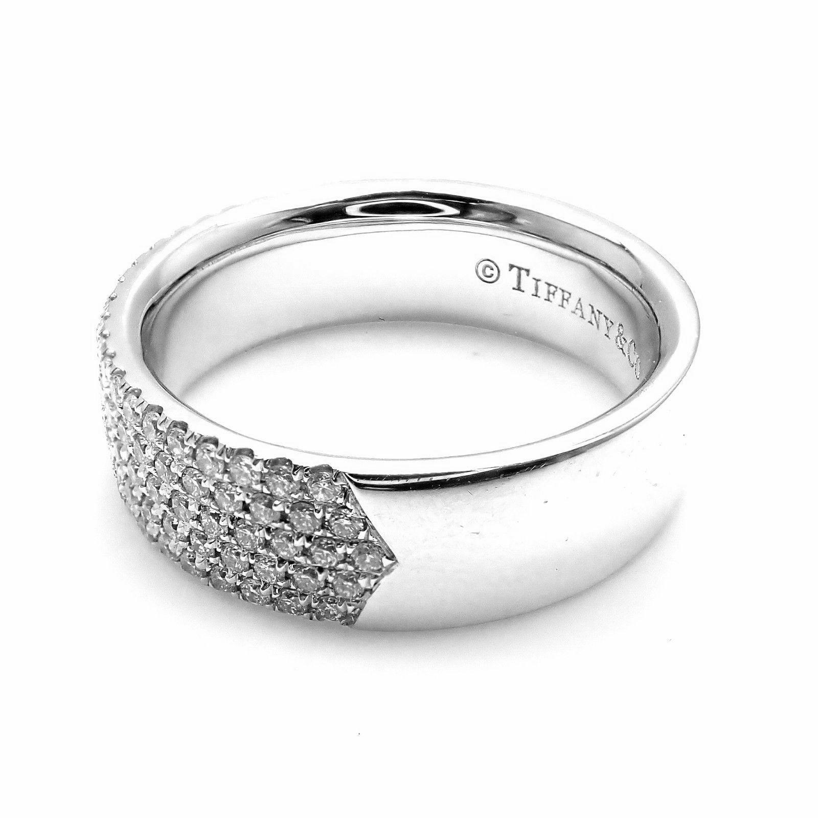 18k White Gold Diamond Metro Five Row Band Ring by Tiffany & Co.
With Round brilliant cut diamonds VVS1 clarity, E color total weight approx. .96ct
Measurements: 
Ring Size: 8
Weight: 10 grams
Band Width: 7mm
Stamped Hallmarks: Tiffany&Co 750
