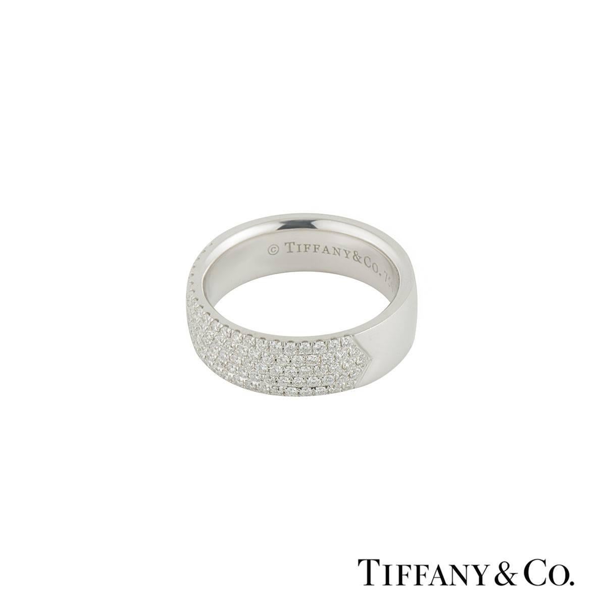 A beautiful 18k white gold Tiffany & Co. diamond band ring. The ring comprises of 5 rows of round brilliant cut diamonds half way around the band with a total weight of 0.76ct, G colour and VS clarity. The ring is a 6mm court fit style band