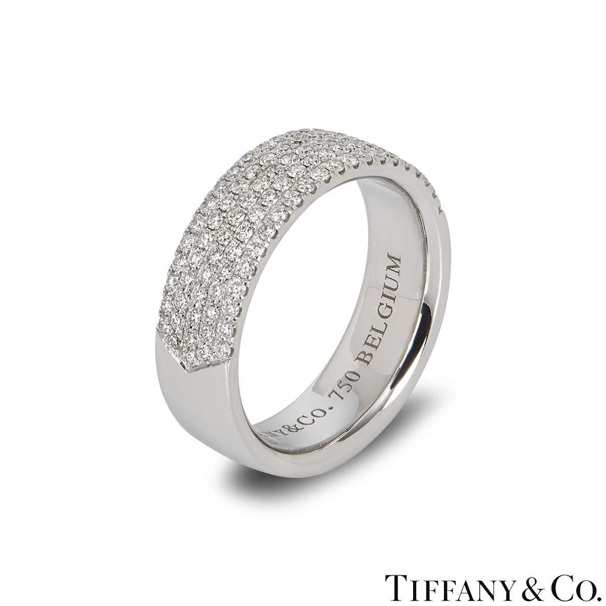 A beautiful 18k white gold Tiffany & Co. diamond band ring. The ring comprises of 5 rows of round brilliant cut diamonds half way around the band with a total weight of 0.76ct, G colour and VS clarity. The ring is a 6mm court fit style band