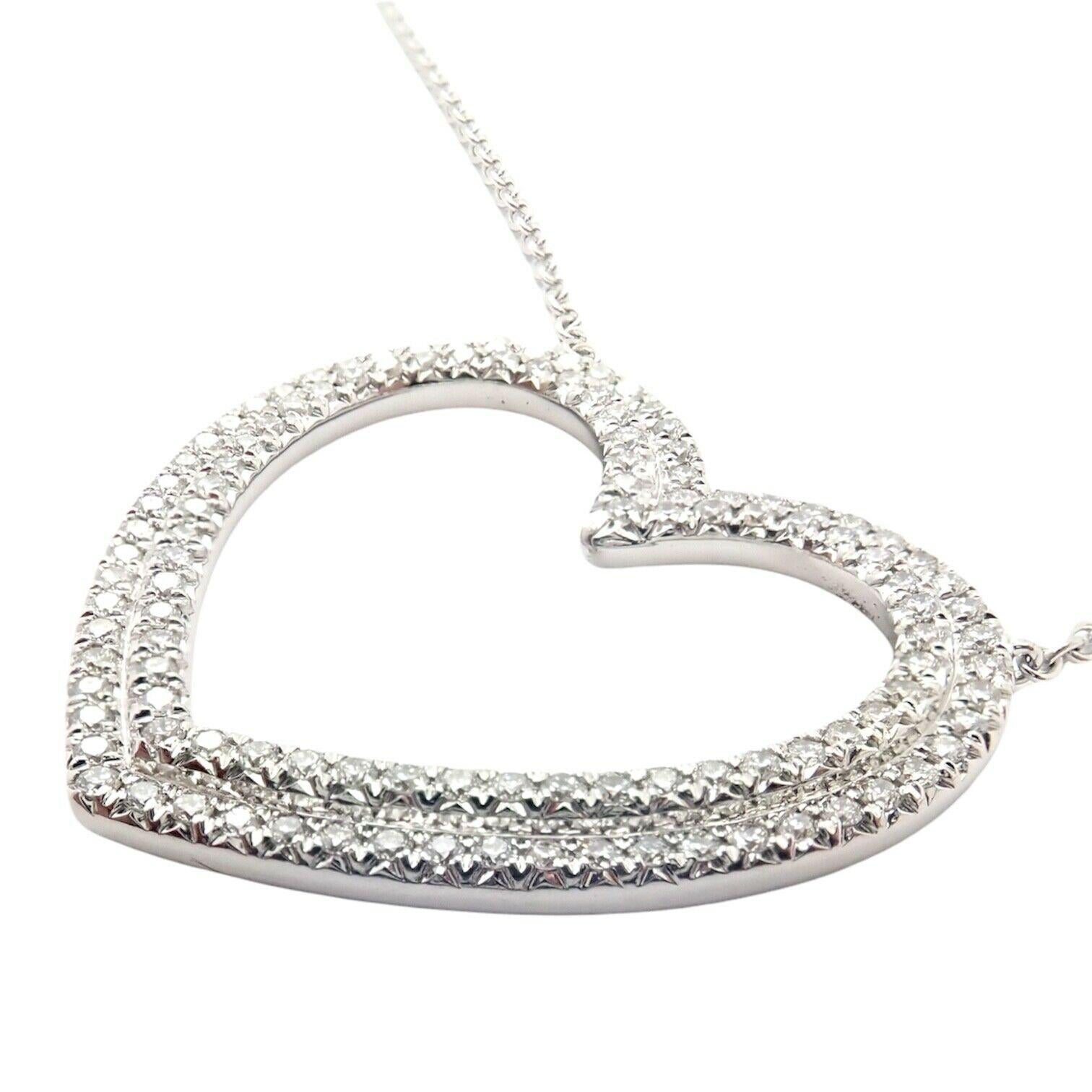 18k White Gold Metro Diamond Large Heart Pendant Necklace by Tiffany & Co.
With round diamonds VS1 clarity, G color total weight approximately 1ct
This necklace comes with Tiffany & Co. box.
Details:
Length: 19.25