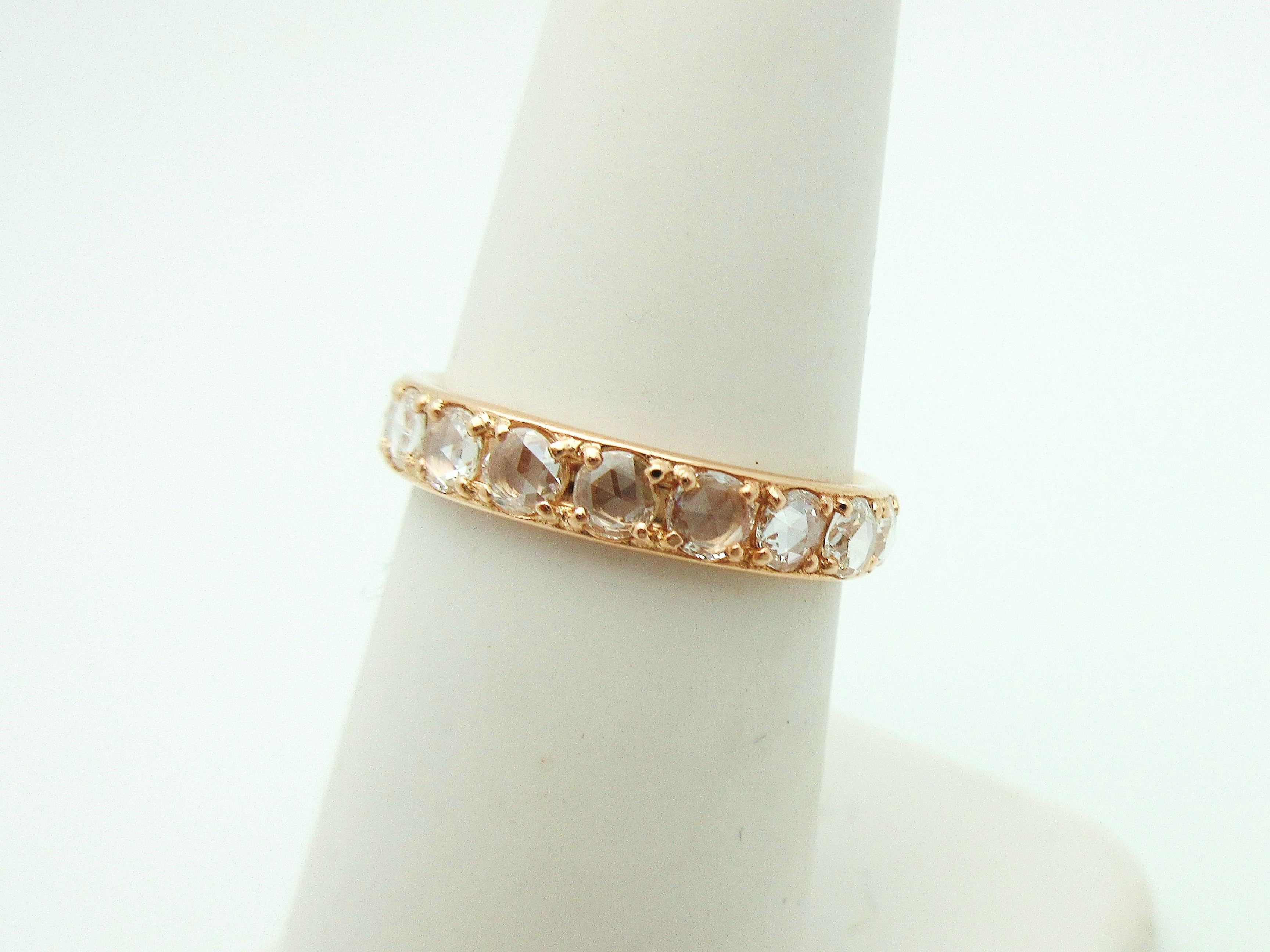 This gorgeous Tiffany & Co eternity band from the Metro Collection brings antiquity into the mainstream.  The 18k rose gold ring is set with 18 sparkling rose cut diamonds weighing approximately 1.14cttw.  The 3.75mm band can be stacked with other