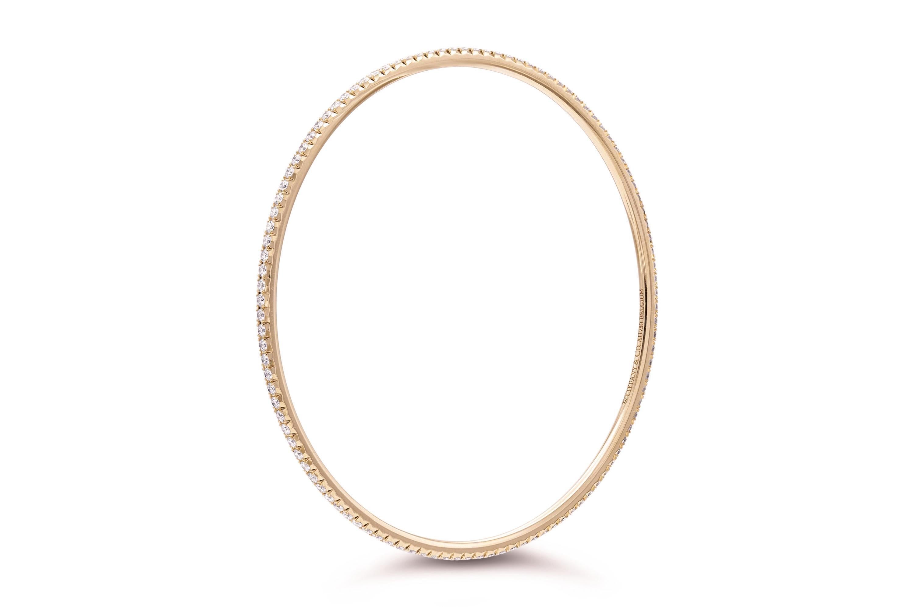 Finely crafted in 18K rose gold with 1.65 carats of Round Brilliant cut Diamonds.
Signed by Tiffany & Co.
Made in Belgium
Size 7 3/4 inches