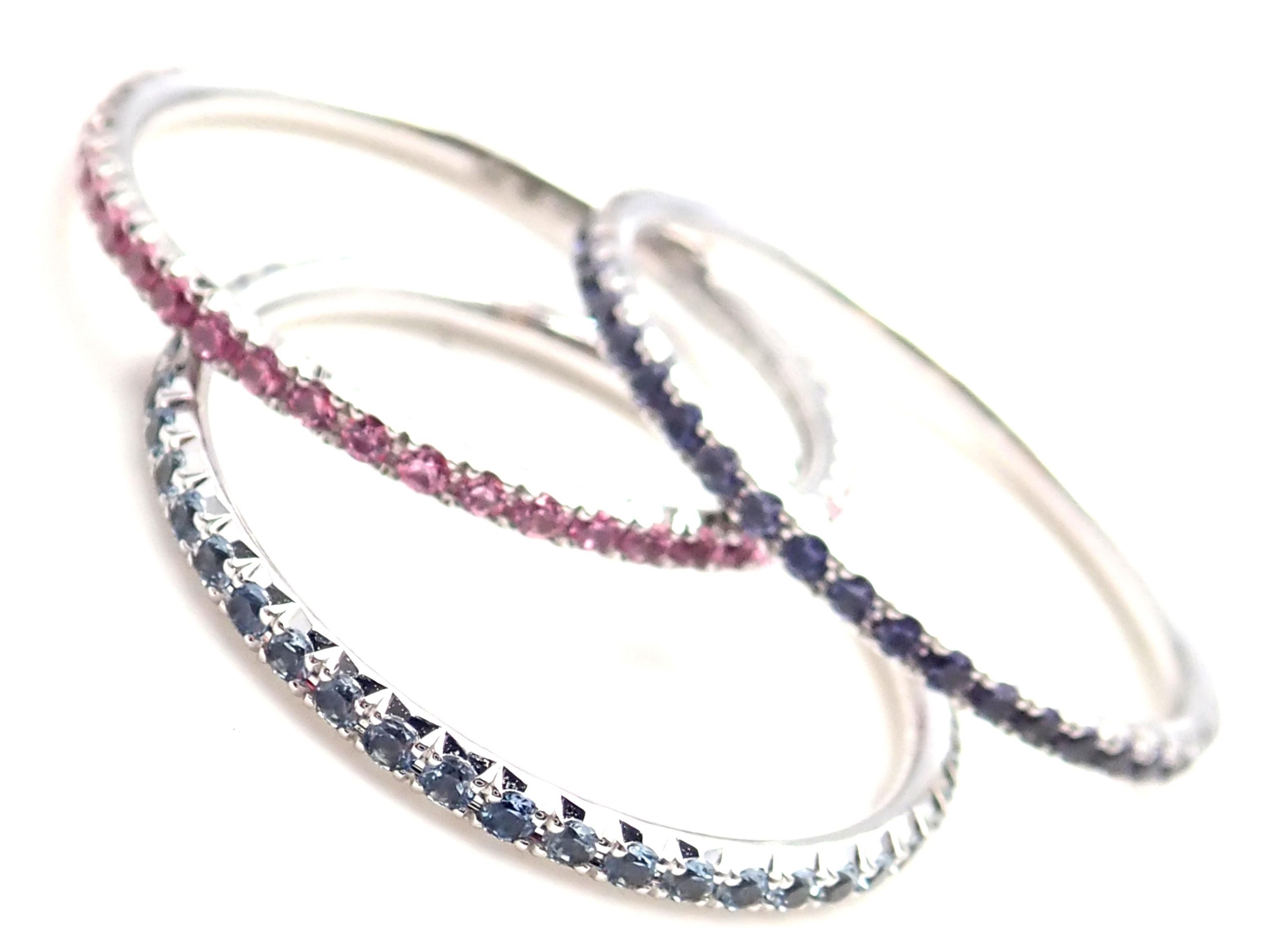 18k White Gold Sapphire Aquamarine Iolite Three Bands Stacking Ring by Tiffany & Co.
With Pink Sapphires total weight approx. .30ct
Iolites total weight approx. .30ct
Aquamarines total weight approx. .30ct
Measurements: 
Ring Size: 9
Weight: All