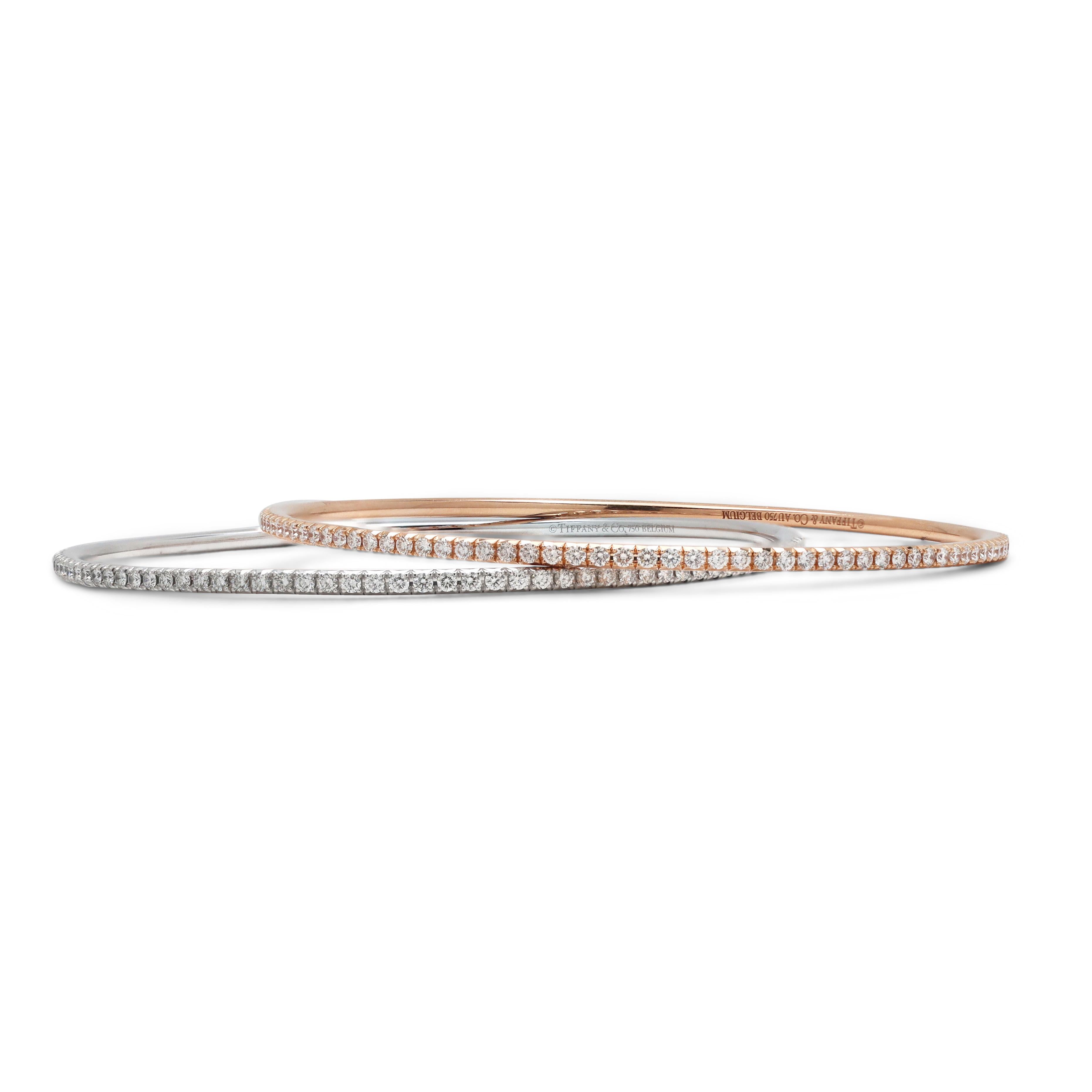 Authentic Tiffany & Co. 'Metro' bracelet crafted in 18 karat white gold and set with glittering round brilliant cut diamonds weighing an estimated 1.65 carats total weight (G-J color range, IF-SI1 clarity range). Will fit up to an 8-inch wrist.