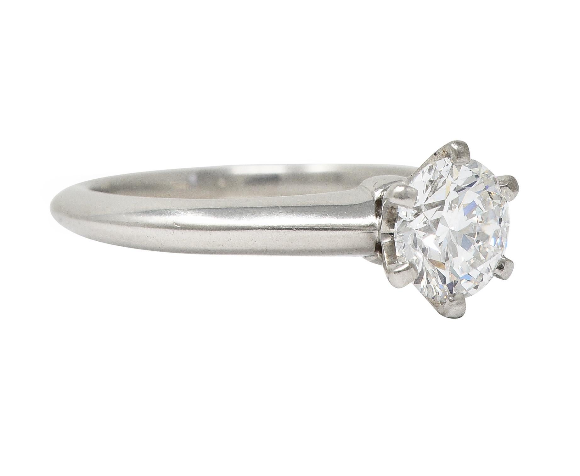 Centering a transitional cut diamond weighing 1.60 carats - D color with VS1 clarity
Prong set in a classic six-pronged Tiffany setting 
Completed by knife edge shank 
Stamped for platinum
Inscribed with carat weights
Numbered and fully signed for