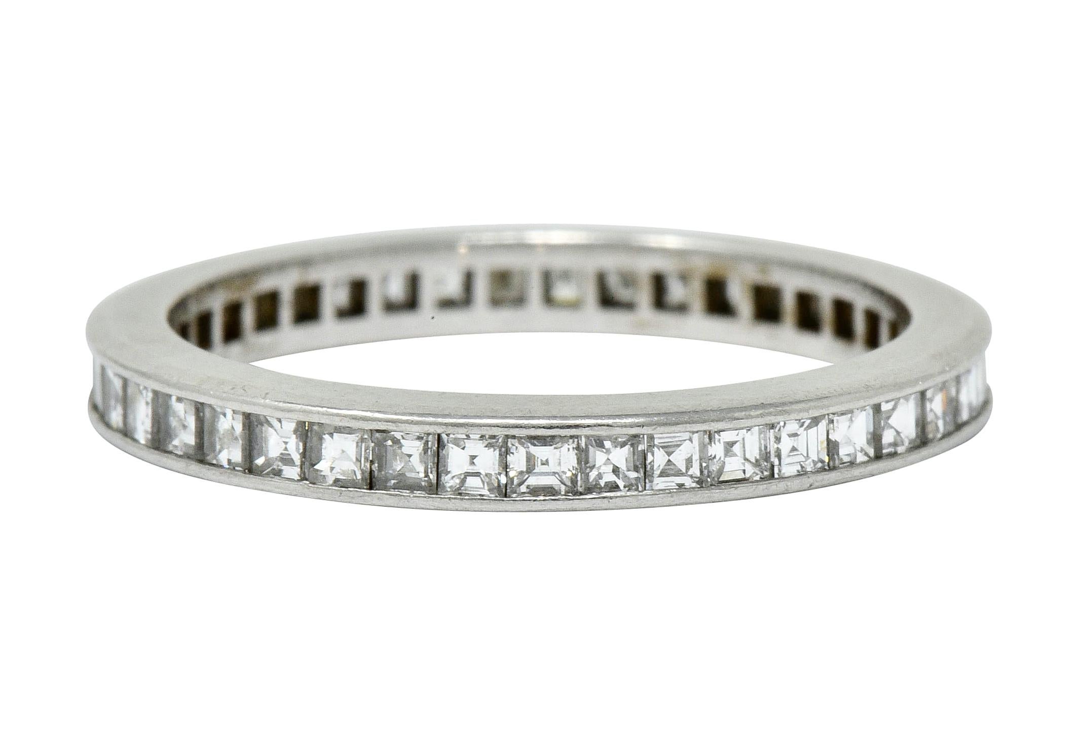 Thin eternity band ring channel set fully around by square step cut diamonds

With total diamond weight approximately 1.25 carats; F/G color and VS clarity

Signed T & Co. and stamped PT950 for platinum

Circa: 1950s

Ring Size: 5 1/2 &