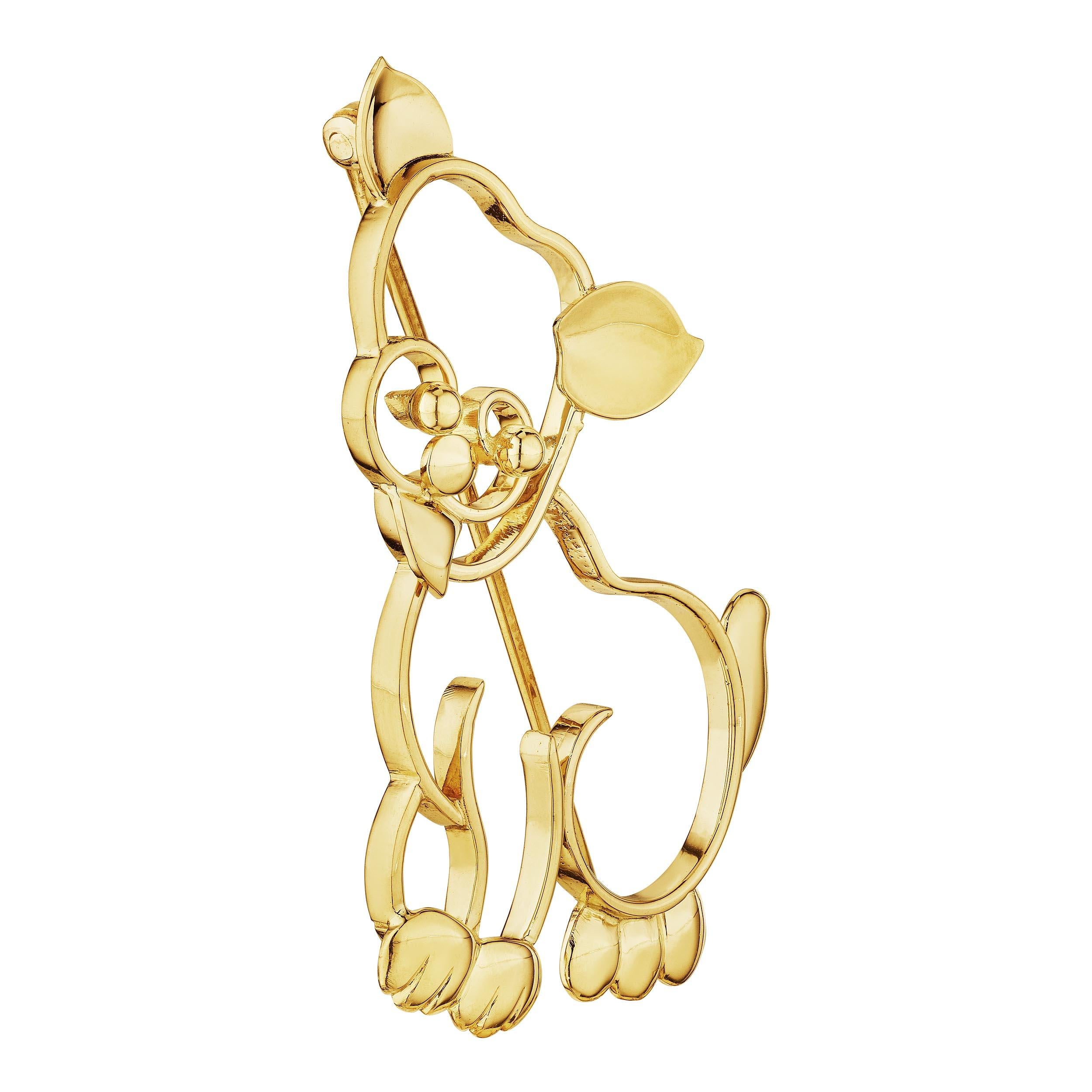 A dog is a man's best friend, and this Tiffany & Co. mid-century 14 karat yellow gold adorable dog brooch will always be your coveted companion..  Signed Tiffany.  Circa 1950-55.  1 3/4