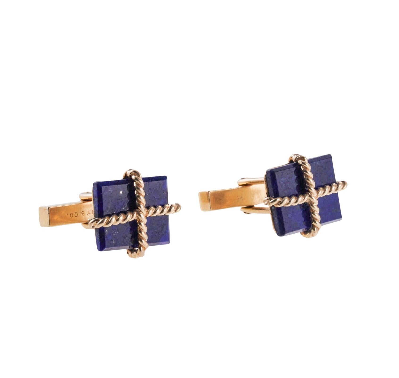 Pair of Midcentury 14k yellow gold Tiffany & Co cufflinks, with lapis lazuli. Each cufflink top measures 17mm x 15mm. Hallmarked Tiffany & Co on the back, engraving on the back side of the top 
