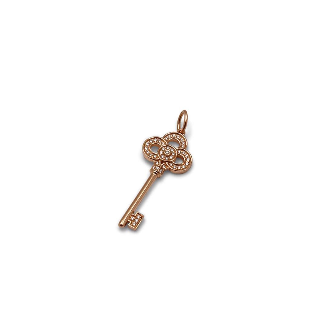 Authentic Tiffany & Co. 'Mini Crown Key' pendant crafted in 18 karat rose gold features a key design set with round brilliant diamonds for an estimated .06 carat total weight. This stunning pendant measures 1 inches in length. Signed Tiffany & Co.,