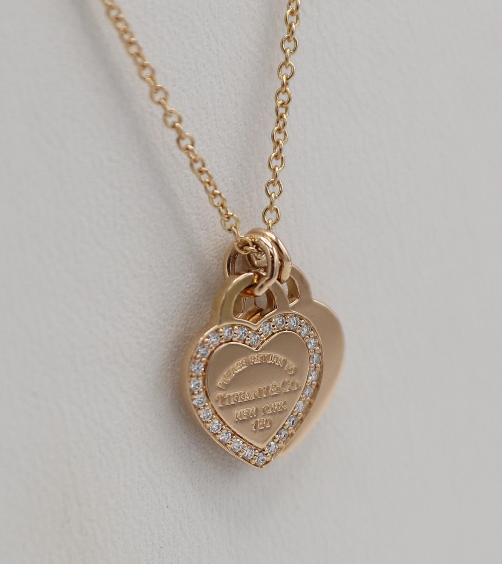 Tiffany & Co. Mini Double Heart Tag Pendant Rose Gold & Diamonds 
Metal: 18k rose gold
Weight: 4.18 grams
Diamonds: Approx. .15 CTW F-G VS round natural diamonds
Chan: 16 inches
Hearts: 10 x 12mm
Signed: Please Return to Tiffany & Co. New York 750