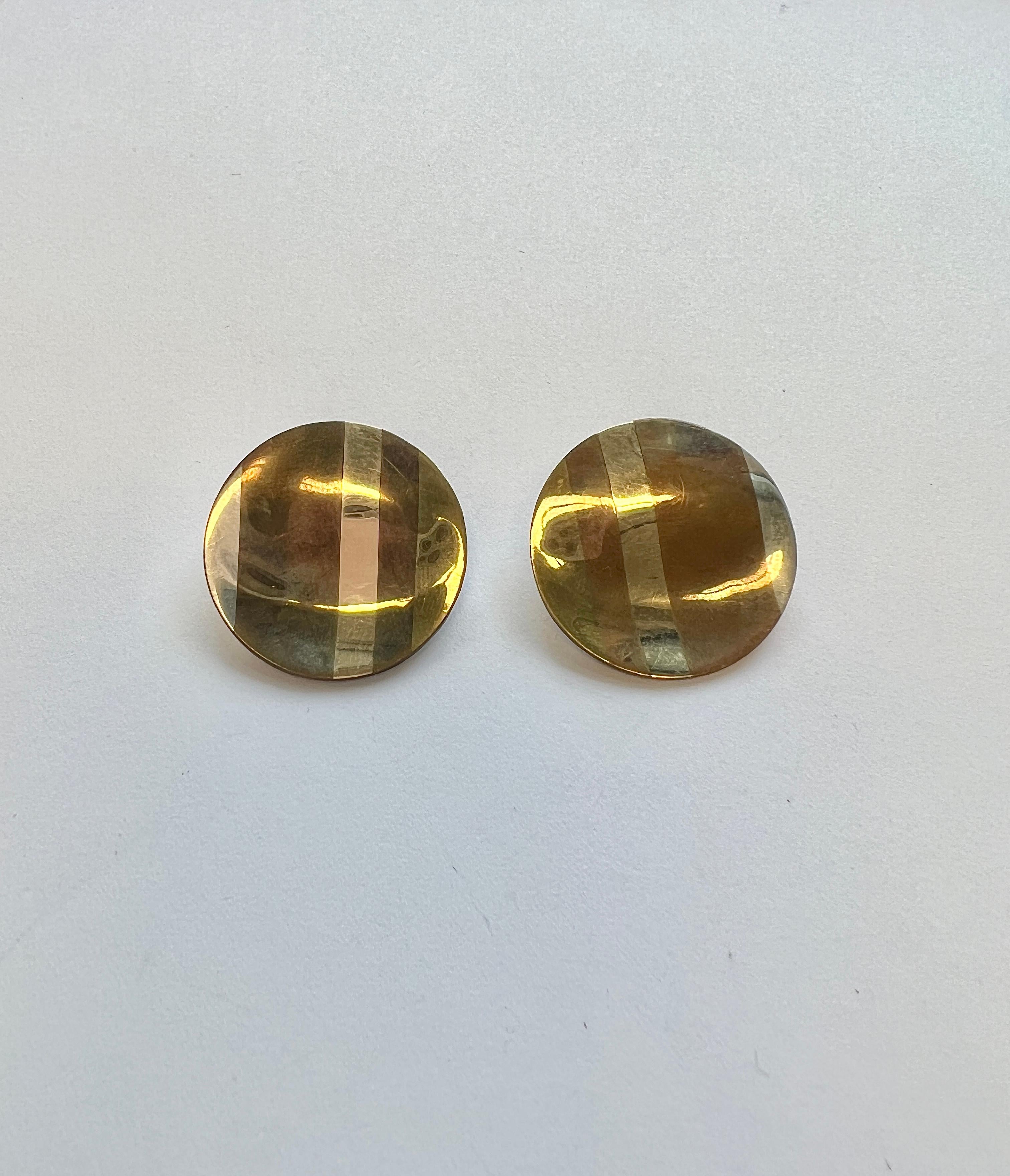 Pair of Tiffany & Co mixed metal inlay earrings, in silver, gold and copper. Earrings are 25mm in diameter. Marked: Tiffany & Co, 81. Weight - 8.8 grams.
