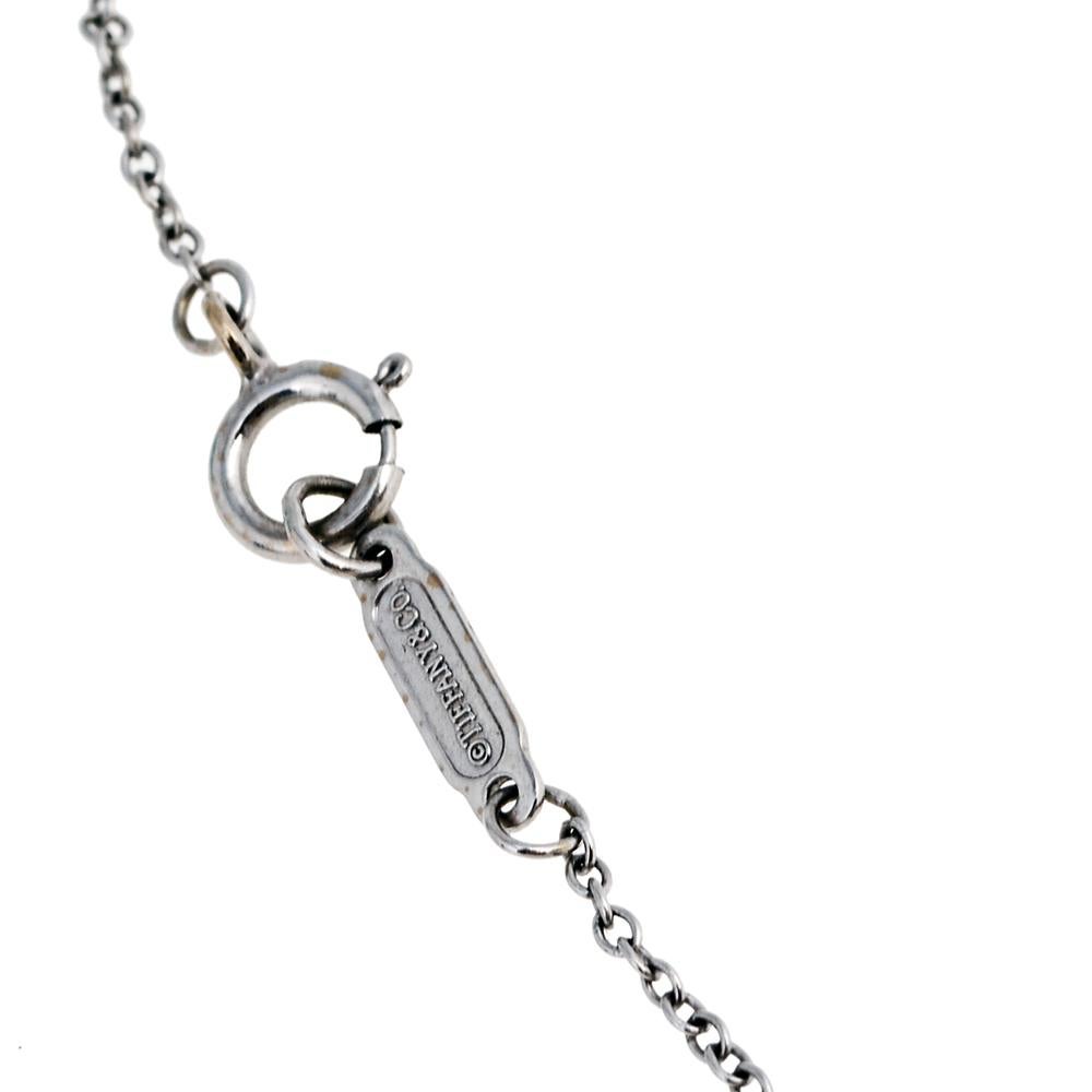 Radiating hope and optimism and symbolizing a bright future, the Tiffany keys from Tiffany & Co. are much loved and instantly recognizable. This necklace, featuring the iconic key pendant, comes crafted from 18K white gold. It is embedded with