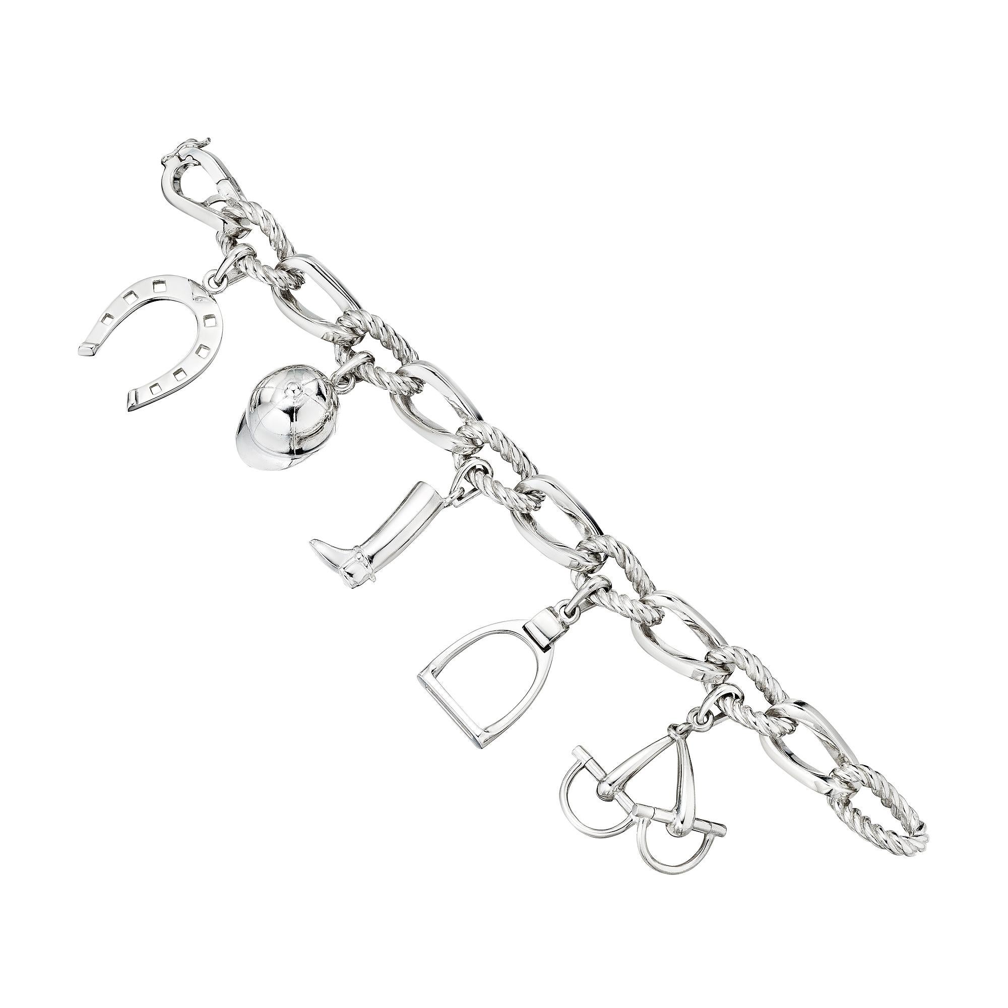 Giddy up.  Show your love of anything equestrian when wearing this Tiffany & Co. modernist sterling silver charm bracelet.  With a horse shoe, stirrups, horse bit, riding boot, and riding hat charms, this whimsical link bracelet will make you get up