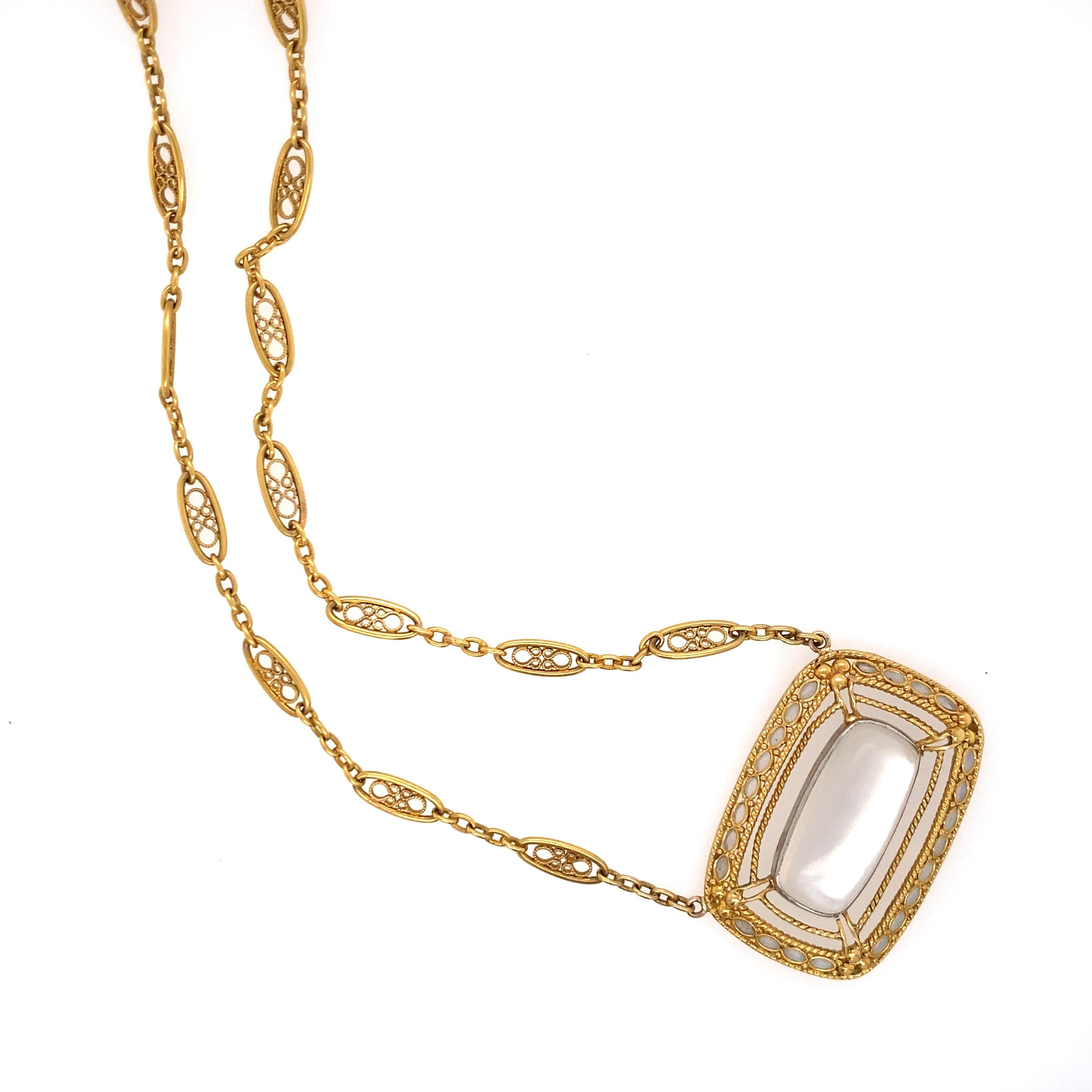 The chain composed of a series of gold filigree links, to the pendant centering an cushion-shaped moonstone cabochon, measuring approximately 20.90 x 9.70 mm, accented by oval-shaped moonstone detail; mounted in 18k gold; length: 24 in.; signed