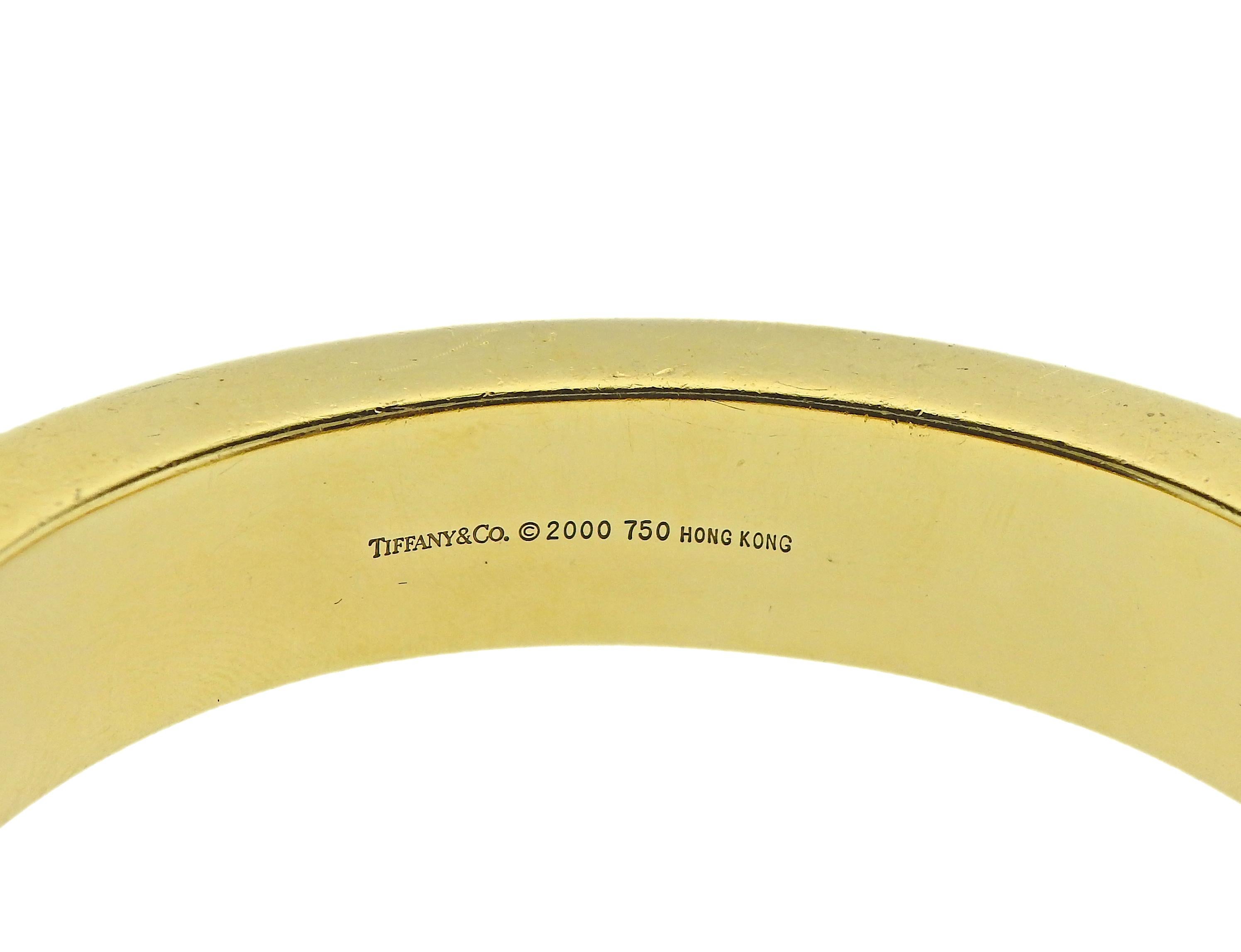 Bracelet en or 18 carats de Tiffany & Co, avec incrustation de nacre et de jade noir dans un motif zébré. Le bracelet s'adapte à un poignet d'environ 6,75