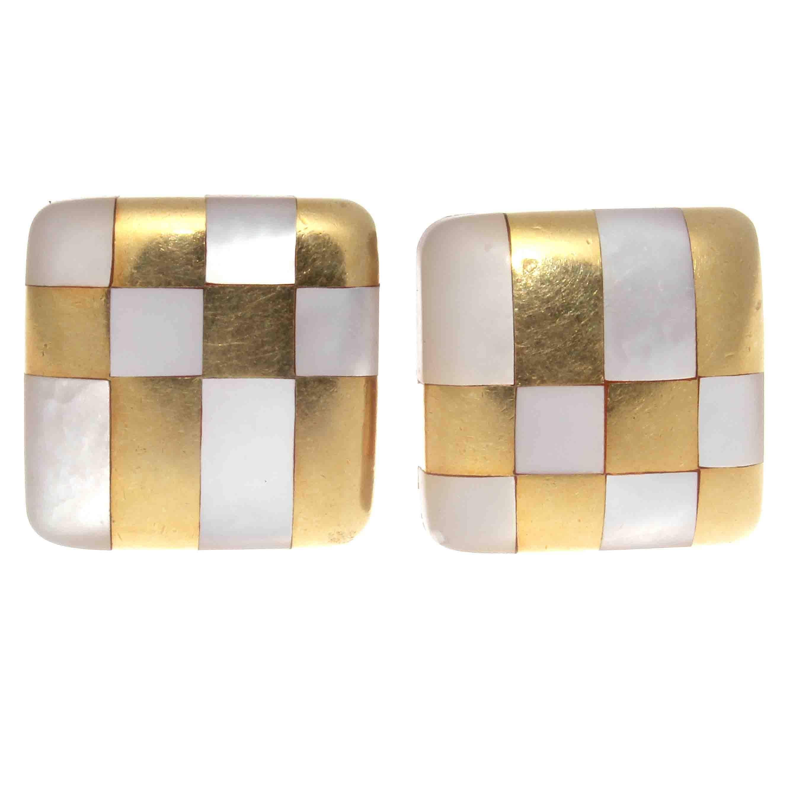 A brilliantly graceful design from one the most iconic jewelry houses. Featuring a checkerboard of pure white mother of pearl intertwined with alternating glistening 18k yellow gold. Signed T&Co