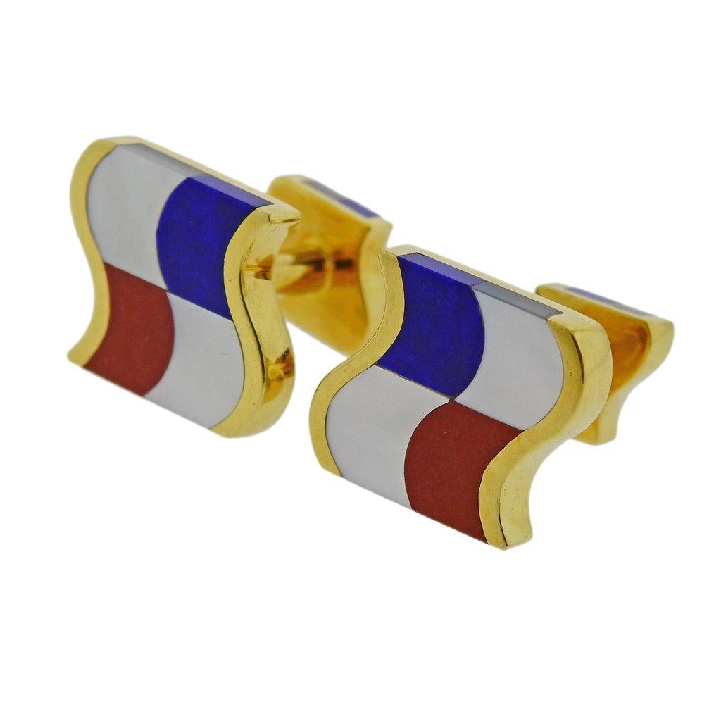 Pair of 18k yellow gold cufflinks by Tiffany & Co, featuring inlayed mother of pearl, coral and lapis. Top is 16mm x 15mm. Weight is 11.8 grams. Marked 750, Tiffany & Co.