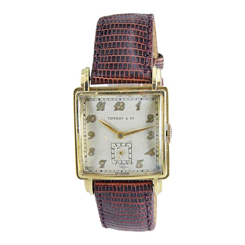FACTORY / HOUSE: Movado Watch Co. for Tiffany & Co. 
STYLE / REFERENCE: Square / Art Deco
METAL: 14Kt. Yellow Gold
CIRCA: 1950's
MOVEMENT / CALIBER: 17 Jewels by Movado
DIAL / HANDS: Original Silver, Breguet Style Arabic / Leaf Hands
DIMENSIONS:
