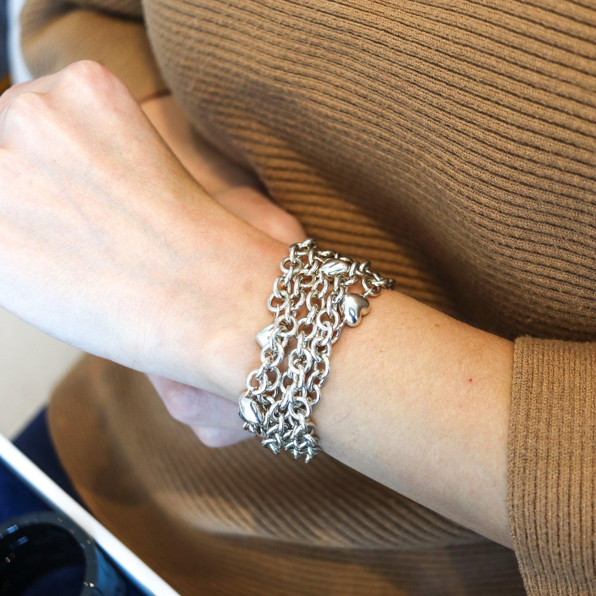 Multi chain bracelet with hearts designed by Tiffany & Co.

This is a pretty and handsome multi-chains bracelet with hearts created by the jewelry house of Tiffany & Co, back in the late 20th century. The bracelet has been crafted in solid .925/.999