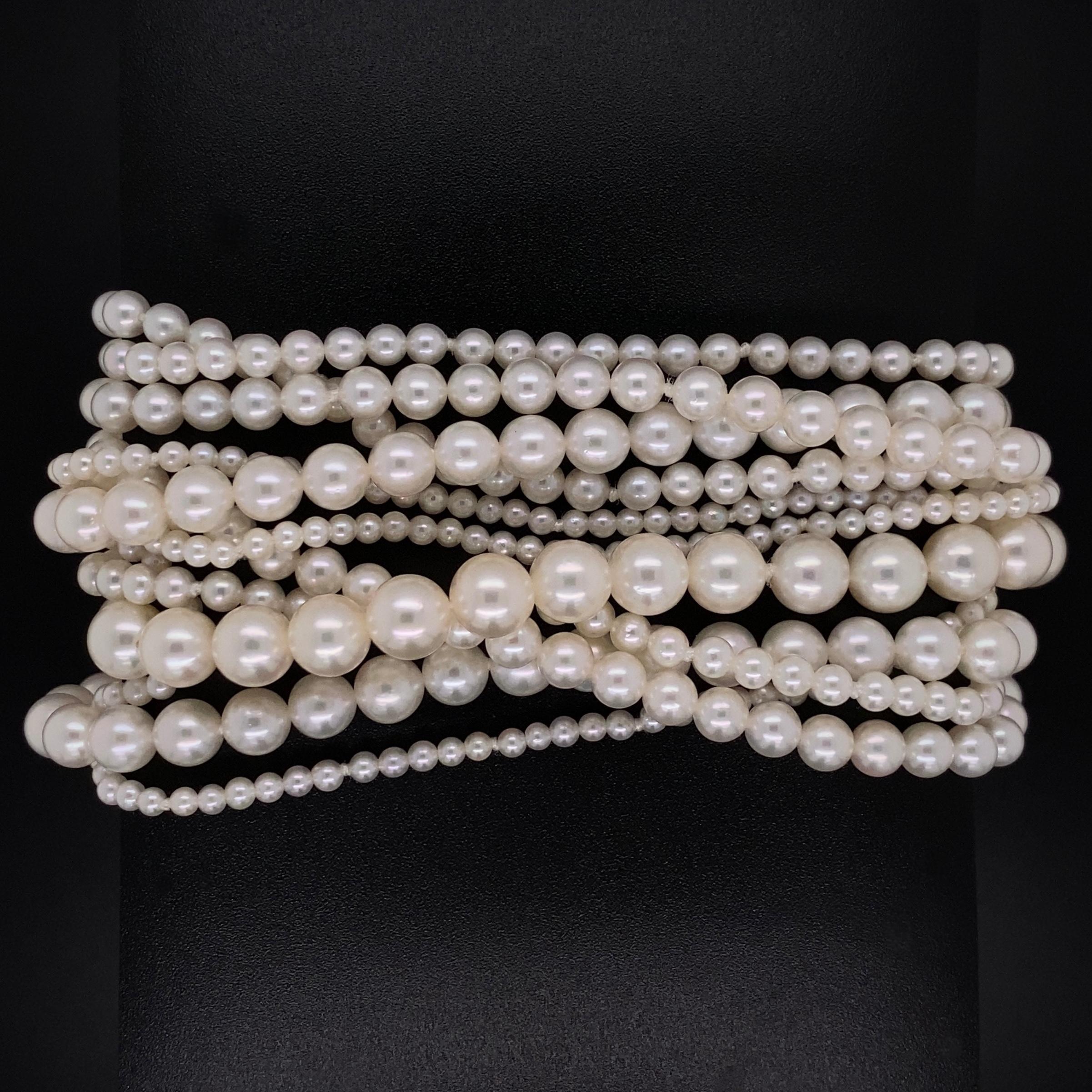 Simply Beautiful! Fine Tiffany & Co. 6.5mm-2.4mm Cultured Pearl 11 Strand Bracelet held by an 18K Yellow Gold clasp. Approx. length of Bracelet: 7.75”. Signed TIFFANY & CO. and marked 18K. More Beautiful in real time...A piece you’ll turn to time
