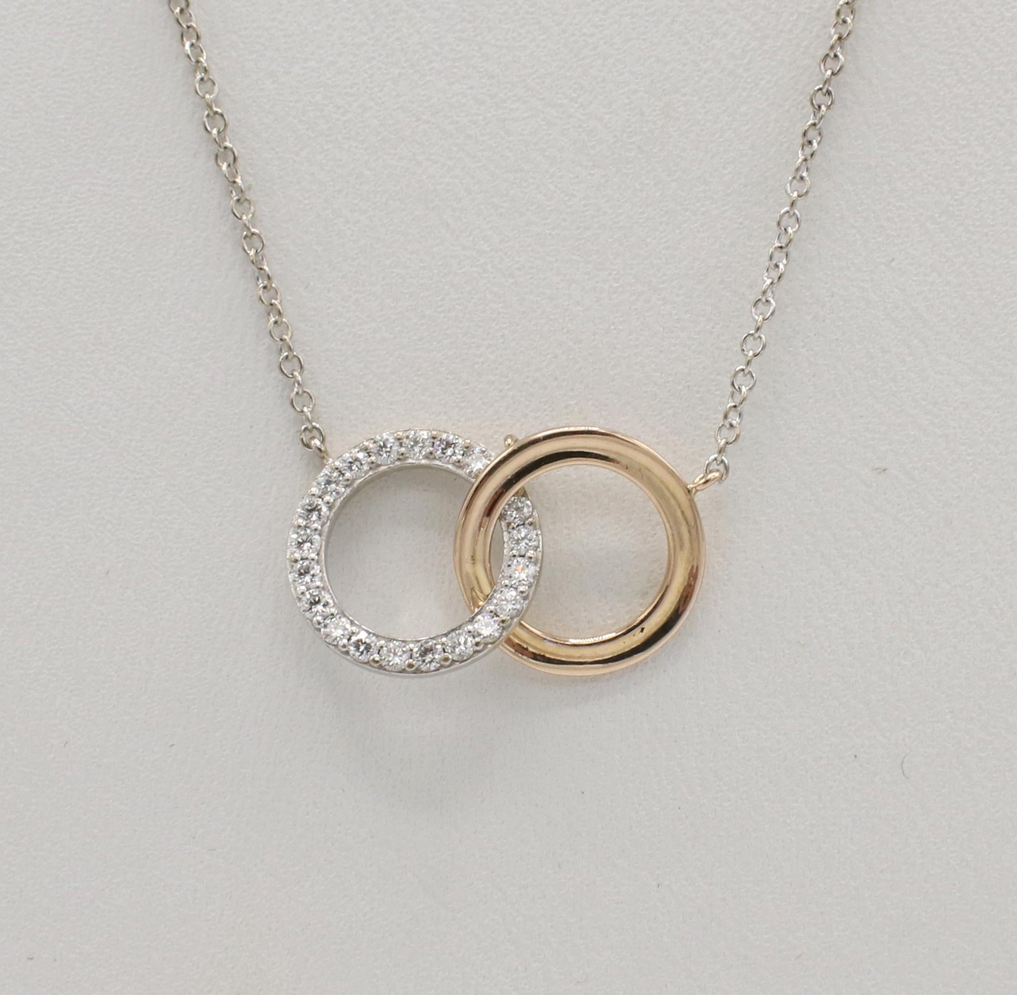 Tiffany & Co. Natural Diamond Double Interlocking Circles Pendant Necklace
Metal: 18k white and rose gold
Weight: 2.79 grams
Diamonds: Approx. 0.20 CTW F-G VS natural round diamonds
Chain length: 16 inches
Circle diameter: 11mm
Signed: ©Tiffany &