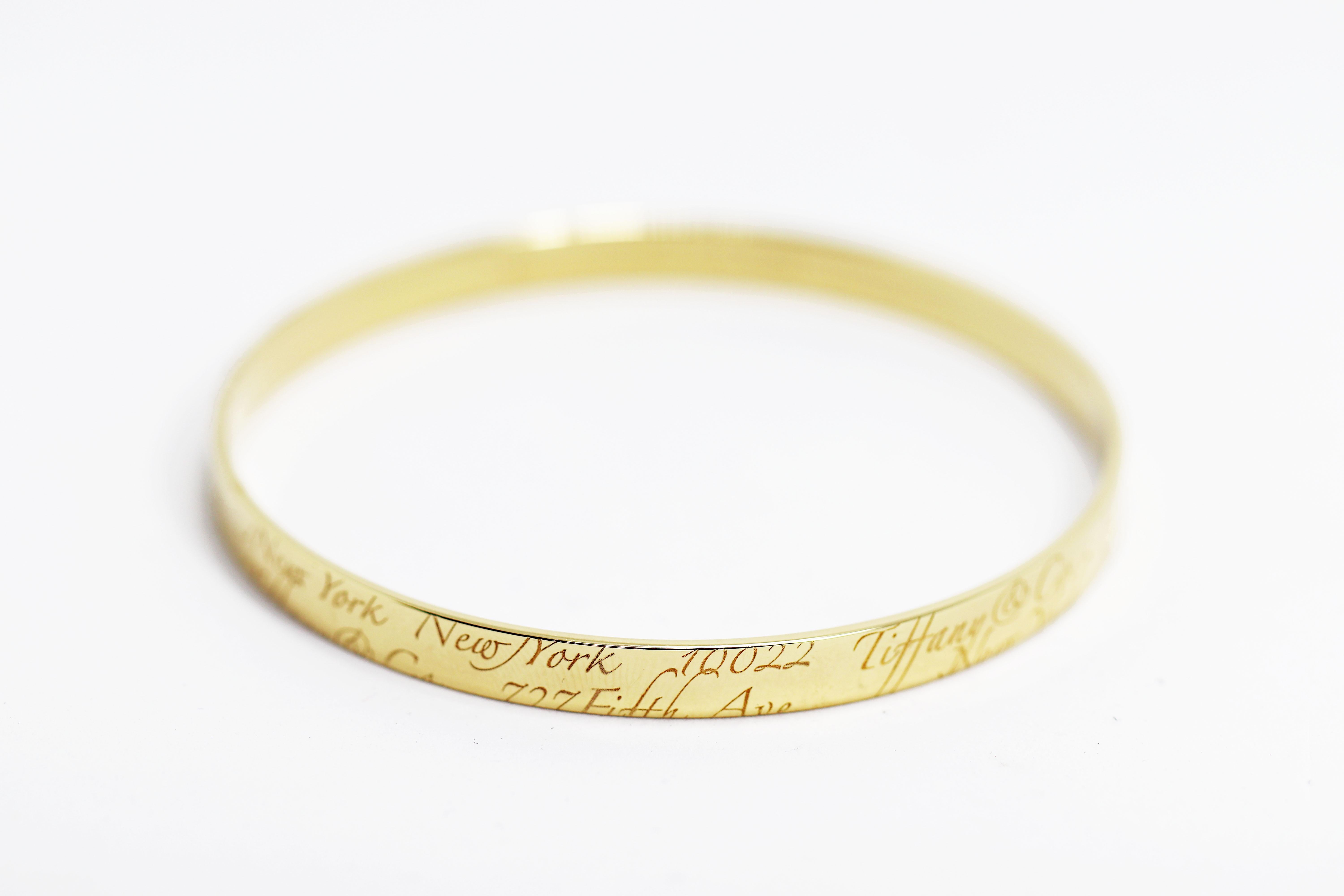 Tiffany and Co. Notes 18 Carat Gold Bangle For Sale at 1stDibs