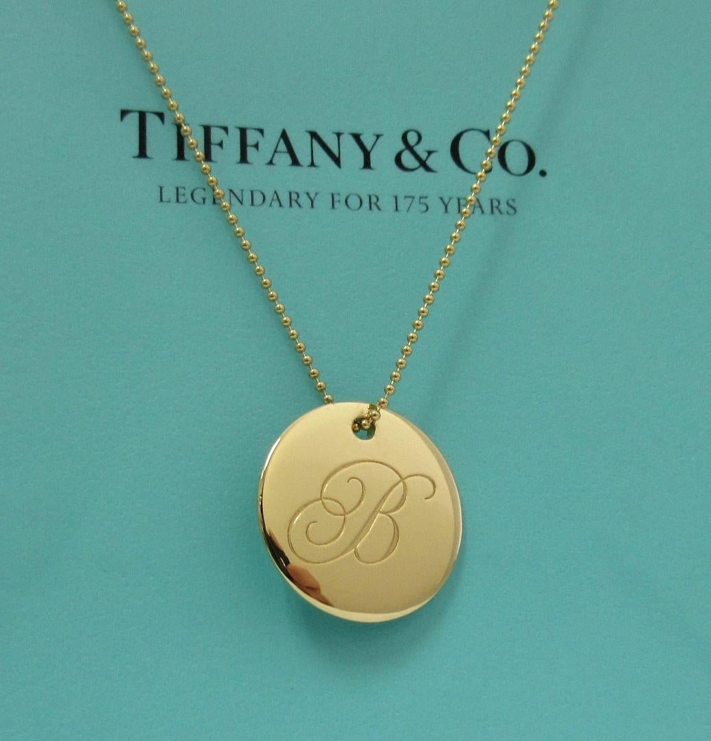 TIFFANY & Co. Notes 18K Gold Alphabet Letter B Disc Round Pendant Necklace LARGE

Metal: 18K Yellow Gold
Chain: 18