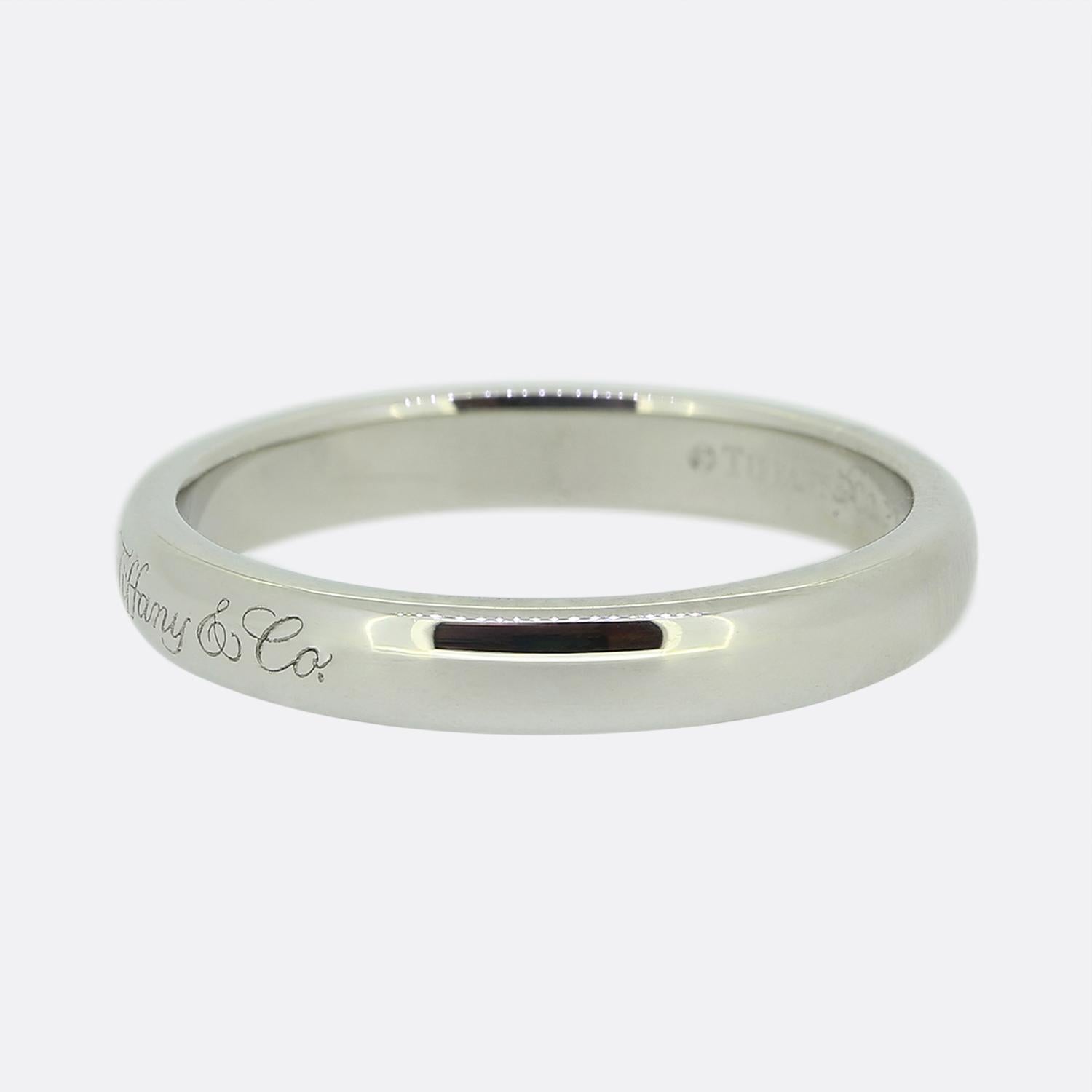Here we have a platinum wedding band ring from the world renowned jewellery designer, Tiffany & Co. This piece showcases a high polished finish with the 'Tiffany&Co.' signature at the face. 

Condition: Used (Very Good)
Weight: 4.4 grams
Ring