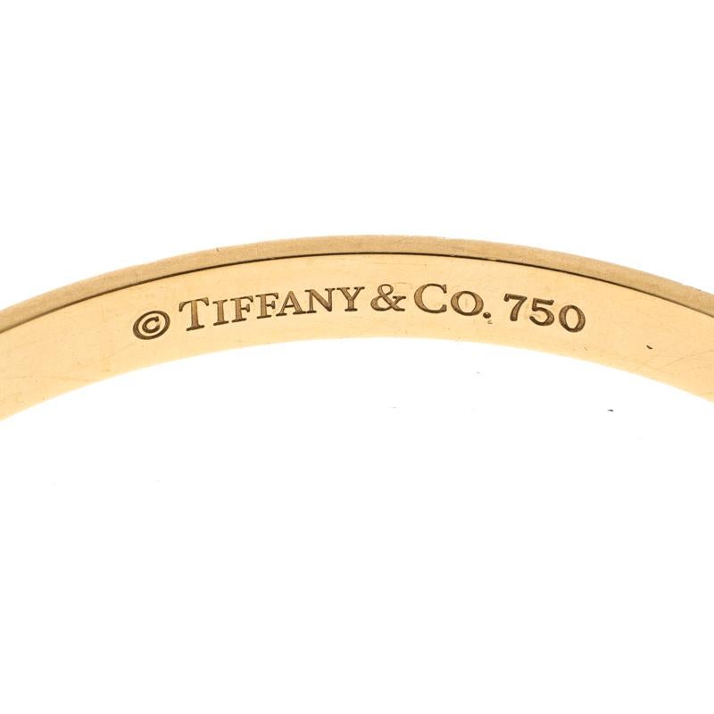 Contemporary Tiffany & Co. Notes Engraved 18k Yellow Gold Narrow Bangle Bracelet 19cm