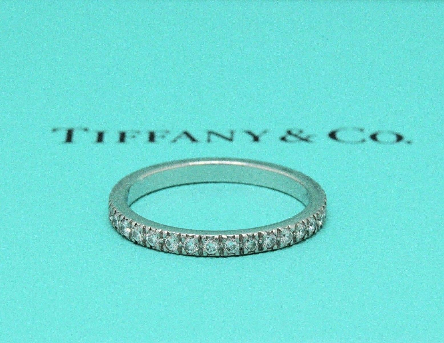 Tiffany & Co.
Style:  Tiffany Novo Diamond Band Ring ( Full Circle )
Sku:  19532593
Metal:  Platinum PT950
Size:  5
Width:  2 MM
Total Carat Weight:  0.36 TCW
Diamond Shape:  Round Brilliant Diamonds 0.36 TCW
Diamond Color & Clarity:  F - G /