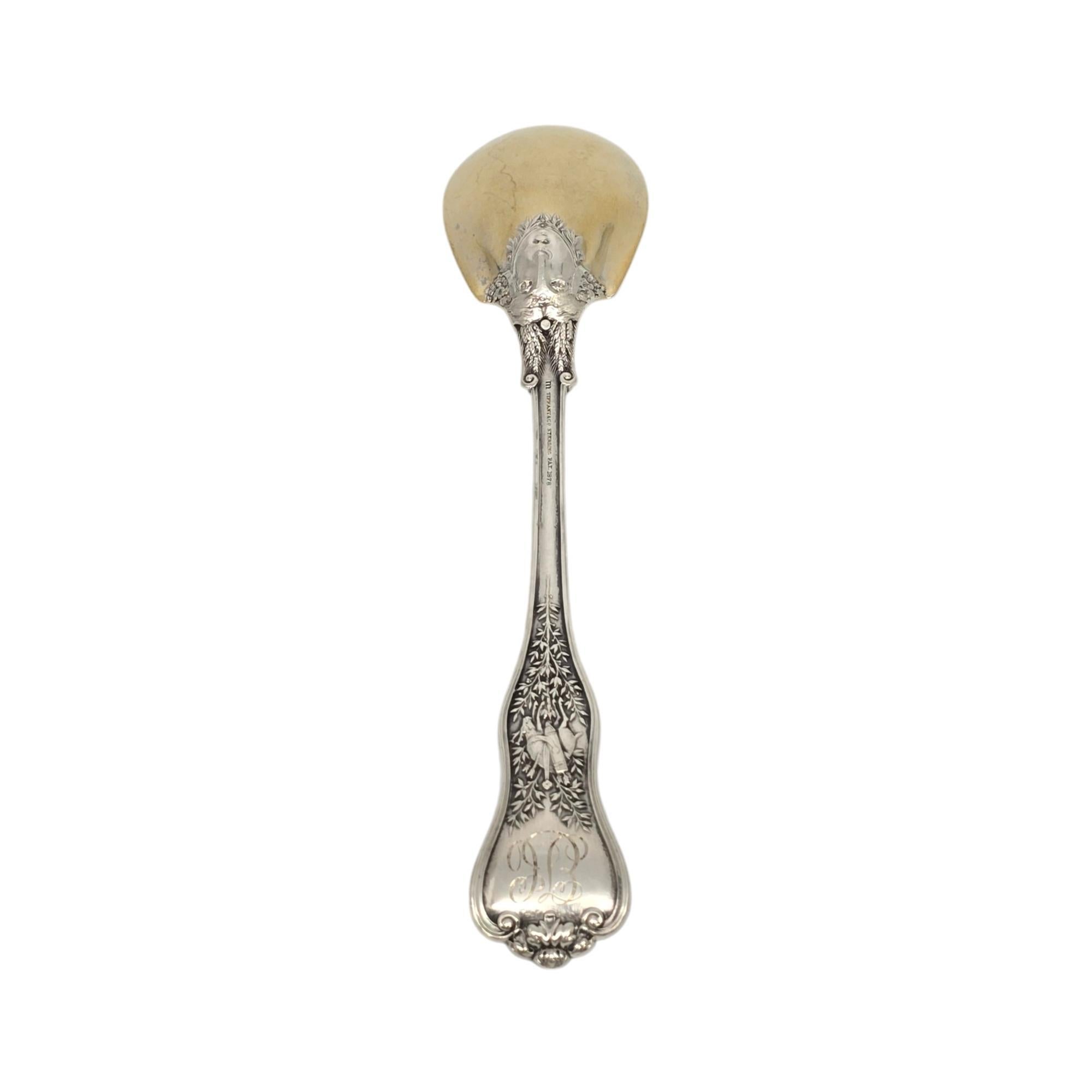 Sterling silver gold wash bowl ice cream spoon by Tiffany & Co in the Olympian pattern with monogram.

Monogram on the back of the handle appears to be EJC (see photos)

The Olympian pattern was introduced in 1878 and discontinued in 1955. It is an